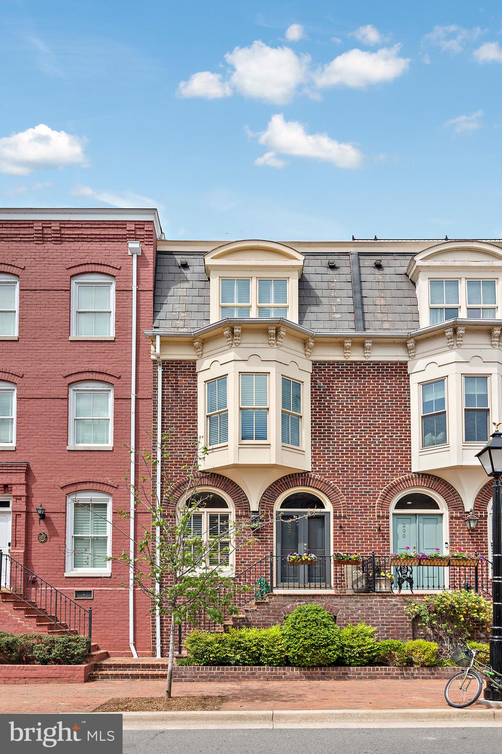 Welcome to 228 N. Union Street, a beautifully updated townhouse located in the heart of Old Town Alexandria. This three-bedroom, three-and-a-half-bathroom residence offers three levels of refined living space, blending historic charm with modern amenities and boasting private rooftop access with stunning Potomac River views.

Step inside to discover a thoughtfully designed interior featuring hardwood floors and abundant natural light. The main level welcomes you with a spacious foyer, a bright kitchen, and an eat-in area. The living room impresses with built-in shelving, a gas fireplace with a marble surround, and access to a private patio—perfect for entertaining.

Upstairs, the primary suite serves as a tranquil retreat with two walk-in closets and an en-suite bathroom featuring a double vanity, a frameless glass shower, and a soaking tub. A cozy den/office with a gas fireplace and built-in shelves offers additional space for relaxation or work. The third level features two generously sized bedrooms, each with its own en-suite bathroom. A dedicated laundry room with a front-loading washer and dryer completes the upper level.

This exceptional property also includes two assigned parking spaces. Enjoy the convenience of being just steps away from the vibrant shops and restaurants on King Street, the scenic Potomac River waterfront, and nearby parks. With easy access to metro stations, major roadways, and Reagan National Airport, this home offers the perfect combination of historic character and modern convenience.

Don’t miss this unique opportunity to own a premier residence in the heart of Old Town Alexandria!
