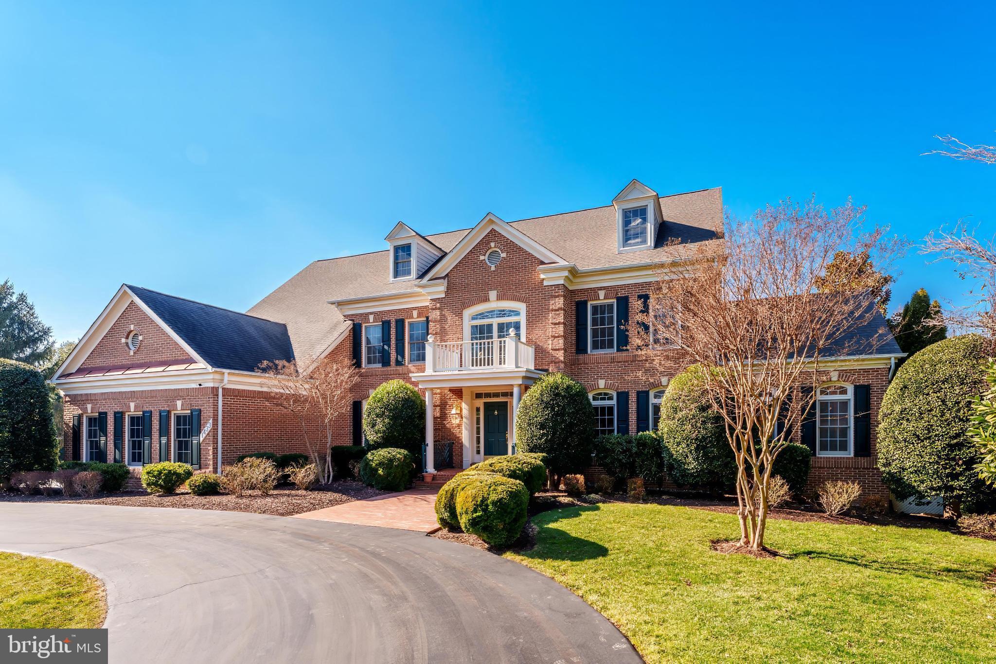 Welcome to 1433 Woodhurst Blvd, a truly exceptional all-brick custom Wyndham model, ideally situated on a rare and expansive 1-acre lot in the prestigious McLean Hundred community. This grand estate offers exquisitely crafted living and entertaining space and enjoys a prime position directly facing the neighborhood park. 
From the moment you enter the soaring two-story foyer featuring diagonal grid marble floors, you’re greeted by a home designed to impress. The main level showcases timeless luxury, featuring oak hardwood floors, intricate tray ceilings, and crown molding throughout. The spacious formal living and dining rooms set the stage for elegant entertaining, while the light-filled sunroom and private office with a custom oak bookcase provide space for relaxation and productivity. The expansive family room, with its dramatic masonry fireplace, skylights, and wet bar, is the perfect centerpiece for gatherings. The chef’s kitchen, entirely with upgraded stainless steel appliances, abundant cabinetry and countertop space, and a sunlit breakfast area, opens to a deck that overlooks the sprawling backyard. A convenient three-car side-load garage, designed for easy access and added curb appeal, completes the main level. 
Upstairs, the lavish primary suite offers a private retreat with a cozy sitting area, a dual-sided fireplace, a walk-in closet, and a spa-like ensuite featuring a jacuzzi jetted tub, dual vanities, and an oversized shower. Three additional oversized bedrooms, each with hardwood floors and access to spacious bathrooms, provide comfort and privacy.
The walkout lower level is equally impressive, offering a massive recreation area bathed in natural light, two large bedrooms, two full bathrooms, and versatile spaces for fitness, storage, or hobbies. Outside, the 1-acre lot provides a tranquil and private setting with endless possibilities, from entertaining on the deck to creating your dream outdoor oasis.
Situated just minutes from Tysons Corner, the Silver Line Metro, Dulles Toll Road, and major commuter routes, this home offers a serene, luxurious lifestyle with unparalleled convenience. 1433 Woodhurst Blvd isn’t just a home—it’s a destination for living, entertaining, and creating lasting memories.