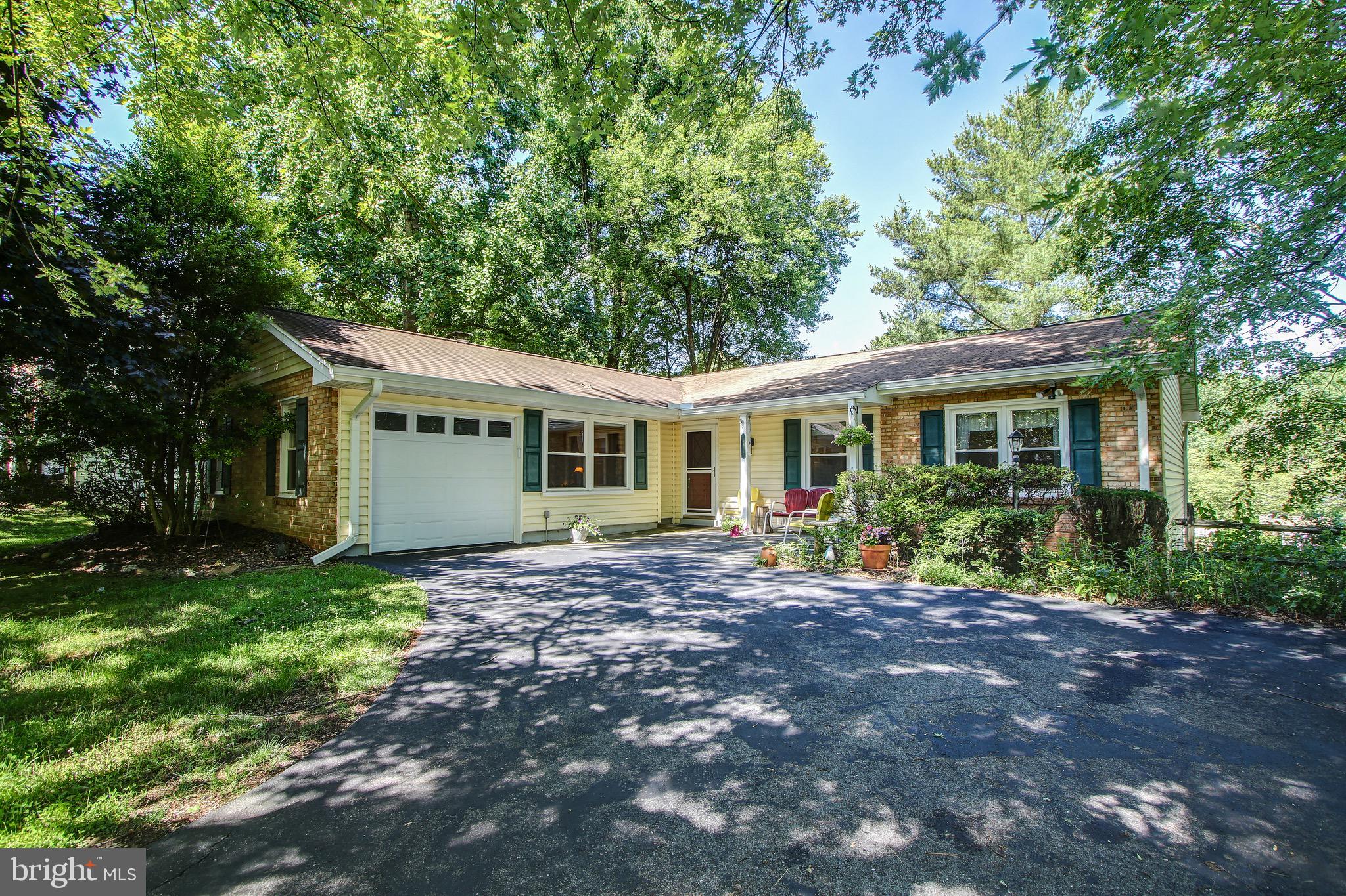 Beautiful single family home in Germantown! This home is situated on a lush .29 acre corner lot with mature trees. The home is well maintained with updated windows, siding, fresh paint, and a large flagstone front porch to welcome you in. The main level features gleaming hardwood floors throughout with 3 bedrooms and 2 bathrooms. Enjoy the open concept living and dining room with direct access to the brand new back deck thats perfect for indoor/outdoor living . Spacious eat-in kitchen with upgraded custom cabinetry, granite counters, and loads of storage space. Off the kitchen is the large family room with a cozy fireplace and garage access as well. The master bedroom is bright with tons of natural light and features a double closet and private ensuite bath. The lower level is finished with an additional half bath and laundry room including a new washer and dryer. There is also tons of additional storage room and a huge rec space with a walk-out to the fully fenced backyard. Peaceful and established community that feeds to Clarksburg schools. Located within minutes of I-270 and public transit. Close to shopping, restaurants, and local parks. Don't forget to check out the virtual tour of this home!
