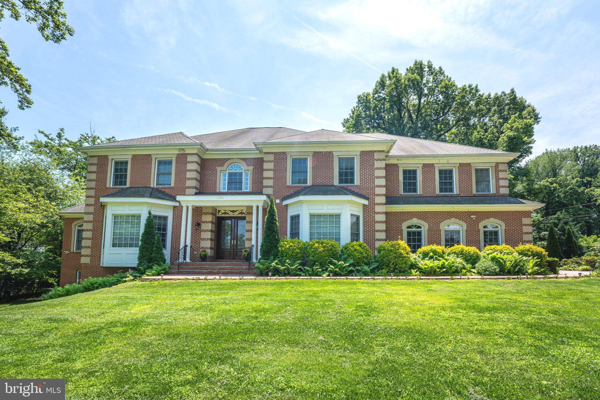 Situated in the heart of prestigious Old Dominion Gardens,  this stunning custom brick estate feels like a warm embrace, offering over 9,500 square feet of magnificence and attention to detail. It’s a home where luxury meets comfort, where every room is thoughtfully planned and meticulously crafted to tell a story of elegance and warmth. From the moment you enter through the front door, you’ll be captivated by the inviting ambiance that welcomes you home.

The beautiful arched entrances and custom-designed floors with Brazilian wood inlay details on the main level further highlight the exceptional millwork found throughout the home. The grand dual living room, formal dining room, family room, and the additional conservatory meet all your entertaining needs with sophistication and style. Just beyond the formal dining room, a built-in wine cabinet offers additional options to store bar-ware and libations.

The expansive gourmet kitchen and breakfast room are flooded with natural light, providing a perfect gathering place. An oversized island offers exceptional workspace, and the butler’s pantry offers additional storage.

Enter into your well-appointed executive office with built-in floor-to-ceiling shelves and a double-sided fireplace, a focal point for fireside reading and conversations.

Accessible by dual staircases, the upper level of this home continues to impress, designed with every need in mind. It features four bedrooms and four ensuite bathrooms, offering ample room for relaxation and privacy. Occupying the west wing of the upstairs, the primary suite includes an oversized bedroom, a large spa-like bath, with his and hers dressing rooms, and his and hers water closets.

The lower level is fully finished, complete with a wet bar and a mini movie theater, creating the ultimate entertainment space. Additionally, this custom home offers a private two-bedroom and two-full-bath living quarters with its own full kitchen, living room, and office. Dual laundry areas—one on the upper level and one on the lower—add convenience to this home. The additional living quarters are approved by the county.

Travel outside to lush landscaping surrounding the residence, creating a picturesque backdrop to the spacious deck where you can enjoy alfresco evenings under the stars or simply bask in the serenity of this expansive garden and fully fenced property.

An unbeatable location, inside the beltway and just minutes from Tysons Corner, provides easy access to world-class shopping, dining, and entertainment options. Major airports and all the amenities of McLean are at your doorstep, and the address falls within the Langley HS Pyramid.

** Accepting Back up Offers **