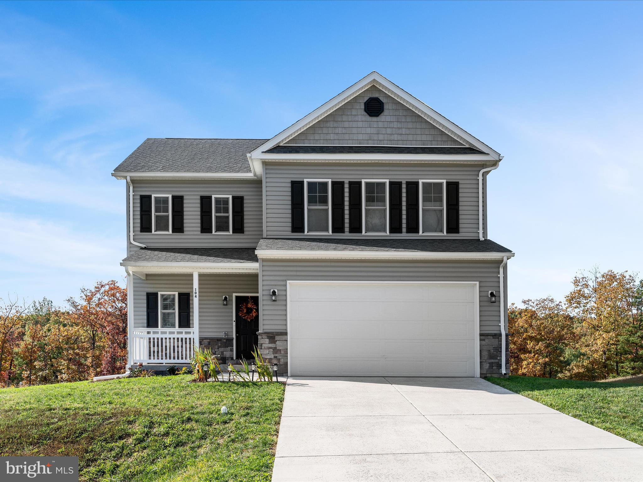 Step into this 1.5 yr old home home nestled in the desirable Middle Creek Vistas community of Inwood. Built in 2024 by Warfield Homes Inc., this modern colonial-style features approximately 1,900+ sq ft above grade, 3 bedrooms, 2.5 baths, and a full unfinished walk-out basement ideal for future expansion including a rough-in for a bathroom.
From the welcoming front porch — perfect for seasonal décor and relaxing evenings — you enter into a bright open plan accentuated by 9′ ceilings and luxury vinyl plank flooring. 

The gourmet kitchen shines with stainless steel appliances, soft-close cabinetry, and upgraded countertops — a space that’s as functional as it is beautiful. 

Upstairs, find a spacious primary suite, two well-sized secondary bedrooms, an upstairs laundry room (for convenience), and a versatile multipurpose loft area — perfect for a home office, media room or play area. 

 Outside, the deck and woodland/garden views at the rear of the lot invite peaceful evenings and outdoor entertaining. 

Additional highlights include a water treatment system by Culligan, owned not rented.  Custom plantation shutters and blinds in each room.  Garage has custom built shelves to allow for extra storage of seasonal items.  

 The community carries a modest HOA fee of about $400 annually currently managed by the builder.

Seller relocating for work; don’t miss this excellent opportunity to make this turnkey home your own.