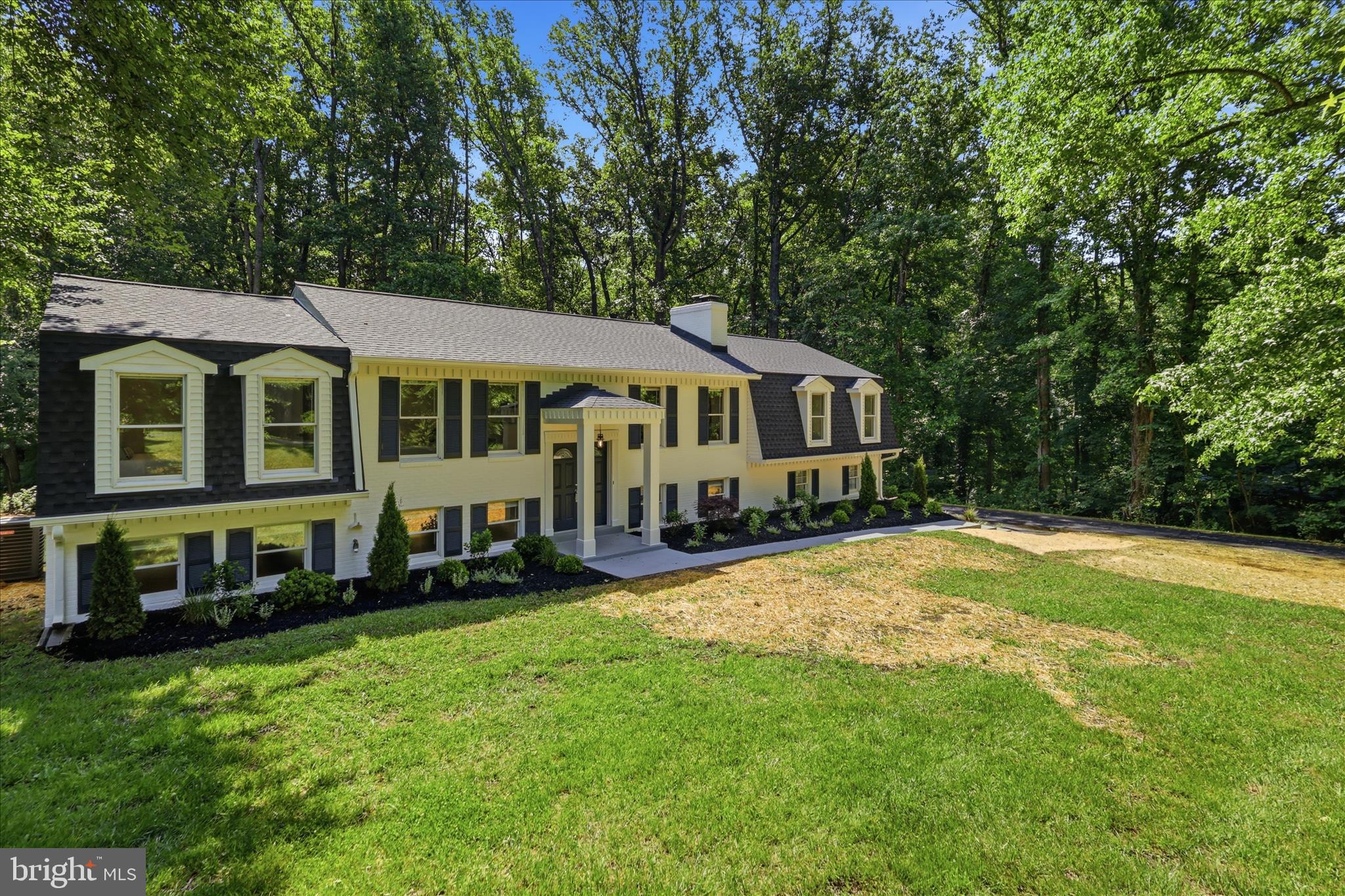 OPEN HOUSE SUNDAY 1-3PM. SHOWN BY APPT. ONLY.
Welcome to 8855 Lowell Road — a stunning fully renovated residence located in the desirable Avon Crest community offering over $150,000 in high-quality improvements, luxury-inspired finishes, and exceptional multi-generational living flexibility rarely found in this price range.

Situated on a beautiful private 1-acre homesite backing to woods with mature trees and a large flat yard, this exceptional property offers the perfect balance of privacy, outdoor space, and sophisticated modern living.

Thoughtfully redesigned with timeless style and elevated finishes throughout, this move-in-ready home combines functional living spaces with luxury-inspired design. From the moment you arrive, the curb appeal is unforgettable with its freshly updated exterior, elegant black accents, designer lighting, manicured landscaping, and welcoming covered entry featuring dramatic double front doors.

Inside, the home has been extensively transformed with updated flooring, beautifully renovated kitchen and baths, contemporary fixtures, recessed lighting, fresh paint, and thoughtfully curated finishes throughout. The stunning open-concept kitchen features quartz countertops, modern cabinetry, stainless steel appliances, oversized seating and serving areas, and stylish black fixtures creating the perfect space for both entertaining and everyday living.

Multiple spacious living areas provide incredible versatility and comfort, including beautifully updated gathering spaces centered around a striking modern black brick fireplace that adds warmth, character, and architectural interest to the home.

A standout feature of the property is the expansive private lower-level in-law or au pair suite complete with two bedrooms, a beautifully updated full bath, kitchenette, large living area, and cozy wood-burning fireplace — offering exceptional flexibility for extended living arrangements, guests, private workspace, or multi-generational living needs.

Additional highlights include updated designer lighting, modern flooring throughout, beautifully renovated bathrooms, spacious bedrooms, dedicated flex/office space, and a large outdoor deck overlooking the peaceful wooded setting.

Ideally located in Pomfret, this exceptional Avon Crest property offers the perfect balance of privacy, recreation, and convenience with close proximity to shopping, dining, parks, commuter routes, La Plata, White Plains, and one of the area’s premier sports and recreation complexes.

Unlike many renovated homes, 8855 Lowell Road offers a true sense of quality, warmth, and craftsmanship rather than simple cosmetic updates. Homes with this level of renovation, setting, style, functionality, and turnkey condition rarely become available.