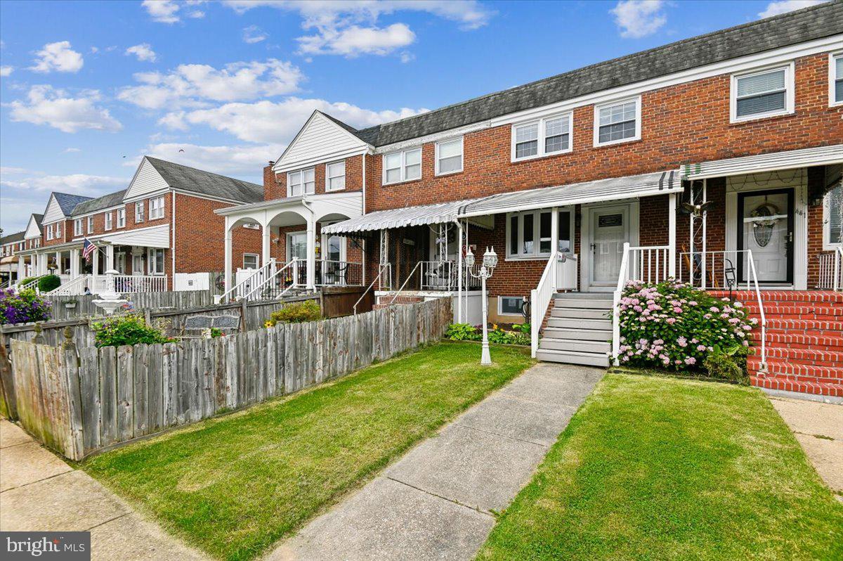 Welcome to this beautifully totally updated three-bedroom townhouse, offering over 1,500 square feet of move-in ready living space. The main level shines with brand-new luxury plank flooring that flows seamlessly from the spacious living room into a separate dining area. The heart of the home is the stunning, upgraded kitchen, boasting crisp white cabinetry, a stylish tile backsplash, and sparkling new stainless steel appliances. A convenient powder room completes the main floor.  Upstairs, you will find three bright bedrooms, including a generous primary retreat with gorgeous hardwood floors, a ceiling fan, and an oversized closet. The completely refreshed full bathroom features a modern vanity, chic fixtures, and a classic tile tub/shower surround.  Downstairs, the fully finished basement provides the ultimate bonus space. With durable luxury plank flooring and recessed lighting, this sprawling recreation room is perfect for movie nights, a home gym, or a playroom—plus, it offers tons of hidden storage. Step outside to enjoy an inviting front porch, a covered rear deck perfect for entertaining, a fully fenced backyard, a handy storage shed, and your own private one-car parking pad.  Seller needs to settle after August 2 of 2026.