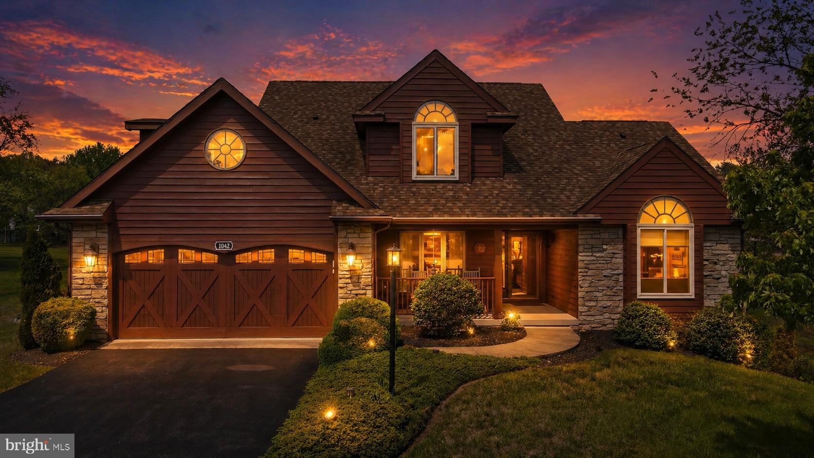 Exceptional craftsmanship and luxury details define this stunning 3-level home, beautifully positioned on the golf course with striking cedar lap siding and stone-accented exterior. A welcoming 2-car garage with carriage-style doors enhances the home’s timeless curb appeal.

The main level showcases an impressive great room anchored by a floor-to-ceiling stone gas fireplace, creating a warm and inviting space for both everyday living and entertaining. The open layout enhances the home’s livability while maintaining a refined, upscale feel.

The primary suite is truly unforgettable—designed as a private retreat featuring its own stone-accented fireplace and a spa-inspired bath with a large jetted tub and a dual-sided fireplace, perfectly positioned to be enjoyed from both the bedroom and bath for a truly relaxing experience. The expansive walk-in closet functions more like a luxurious dressing room.

The kitchen is beautifully appointed with new stainless steel appliances and sleek Silestone countertops, which continue into the bathrooms for a cohesive, upscale finish. Solid wood doors and heated tile flooring throughout the home add an extra layer of quality and comfort.

The lower level offers an exceptional extension of living space, featuring its own private secondary primary suite, complete with a full bath and a spacious family room area. A third fireplace with a charming wood mantel adds warmth and character, creating a cozy yet refined atmosphere. Designed with flexibility in mind, this level also includes a separate exterior entrance, making it ideal for guests, multi-generational living, or a private retreat—offering both comfort and independence within the home.

Outdoor living is just as impressive, featuring a spacious 12x24 screened porch with low-maintenance TimberTech decking—perfect for entertaining or relaxing. Below, a covered concrete patio provides even more functional outdoor space.

Perfectly positioned and beautifully appointed, this golf course retreat embodies elevated living—where luxury, comfort, and thoughtful design come together effortlessly.