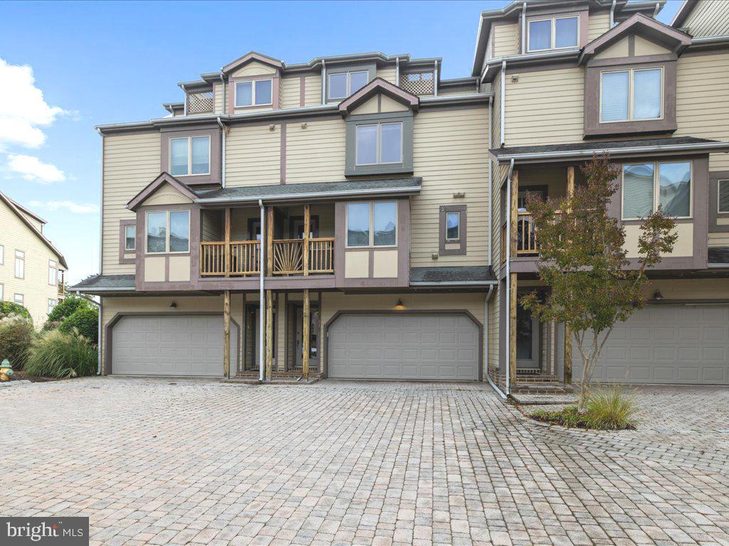 **Be the buyer to benefit from a Price Reduction and a new HVAC system**  Feel your stress melt away the moment you pass through the gates of Chesapeake Harbour, an unsurpassed resort-style community situated on the banks of the storied Chesapeake Bay!  This spacious upper-level townhome affords million-dollar views at a price difficult to find in Annapolis.  The living room is dramatically enriched by high ceilings, eastern-facing oversized windows/transoms/doors and a gas fireplace for instant ambience.  Allow the 8' doors to invite you out on the balcony to take in the sun and lunar rises and enjoy the water views and bay breezes.  The kitchen is enhanced with stainless appliances, granite counters, a wine fridge, plenty of cabinetry providing abundant storage and prep space to satisfy your inner gourmet.  You'll have plenty of room for entertaining in the adjacent dining area, overlooking the family room and water views beyond.  The water-side owner's suite provides vaulted ceilings, a walk-in closet with additional closet space, ceiling fan and french doors to balcony.  Sunrises will nudge you awake in the morning and the lunar rises will fill you with awe in the evening.  The spa-inspired ensuite bath provides all the requisite accoutrements for unwinding at the end of the day; simply bring the Champaign.  Two additional bedrooms are available for family, guests or office/exercise space with adjacent full bathrooms for added convenience.  You'll benefit from updates the owner has performed, e.g., new carpeting entry stairs and main level, new refrigerator, dishwasher, new Marvin windows throughout and other updates owner has made during her ownership.    Automobiles and your favorite toys have a place as well in the oversized attached garage.  Harbour Marina Village is the only village within Chesapeake Harbour that enjoys attractive paver courtyards, lanes and drives, gas cooking, heating and fireplaces, and it's own Exercise Room.....Very Special!  Outdoor amenities abound making Chesapeake Harbour the envy of Annapolis.  Enjoy two fabulous pools, one of which is Bay-side with unparalleled views across the bay to the eastern shore.  Additional offerings include three tennis courts, two pickleball courts,  two fishing/crabbing piers, natural shell paths, picnic areas complete with grills, a community beach to launch small watercraft for a day of of water sports or simply to relax and soak up the sun.  A new addition to CH is the Canton Kayak Club with memberships available through their website. 
 Chesapeake Harbour surrounds a first-class marina with slips for lease that can accommodate just about any size boat.  After a day of fun and sun, stroll over to the Beacon Waterfront Galley & Bar for locale fare, libations and to mingle with neighbors and friends.  You owe it to yourself to explore the inspiring possibilities Chesapeake Harbour has to offer, particularly in this unique and special townhome.  Don't miss out on this opportunity for a fabulous lifestyle in a delightful property just minutes to area parks, shopping, dining, Historic Annapolis, the Maritime Republic of Eastport, the Naval Academy and other cultural attractions.