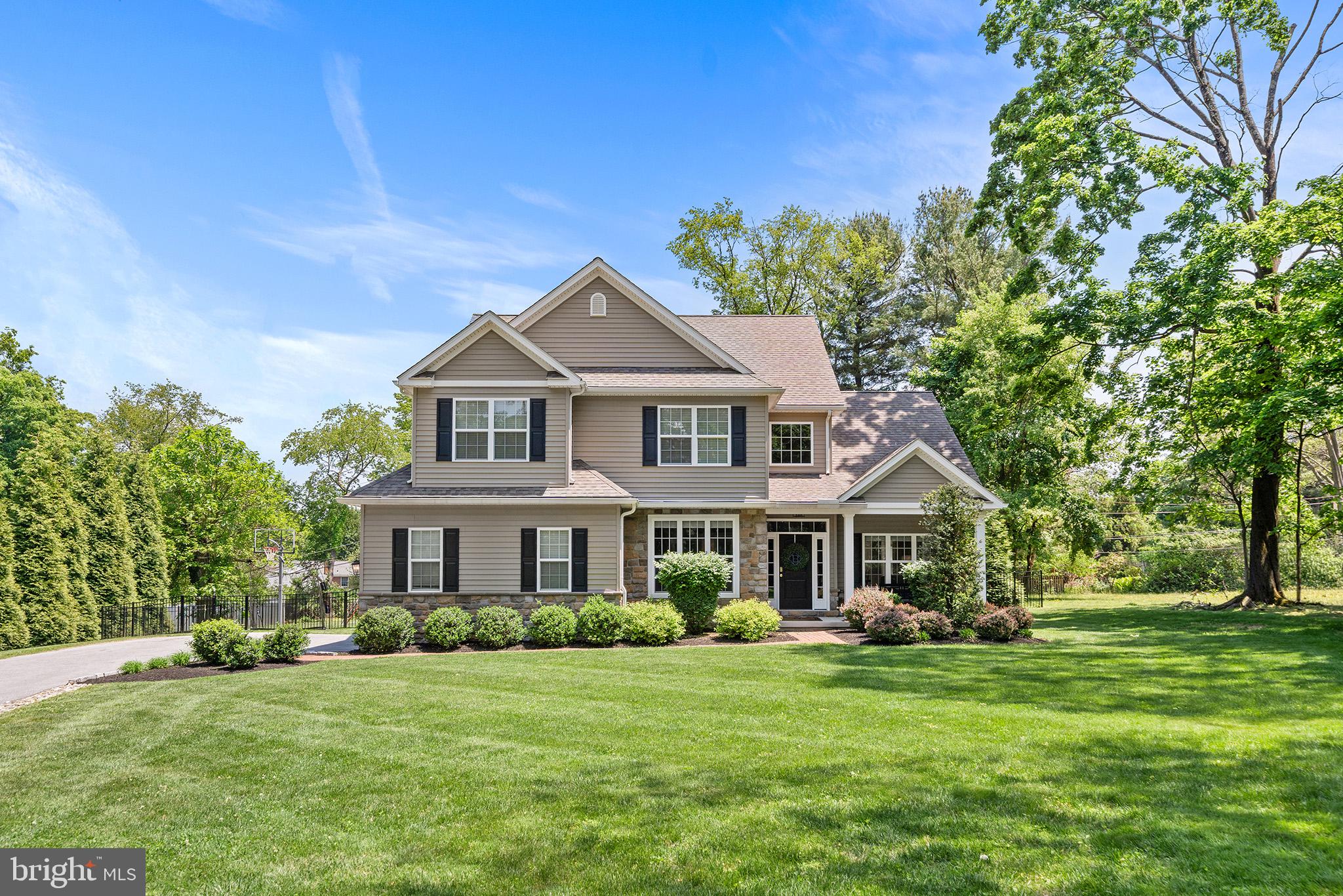 Set back beautifully from the road on three-quarters of a flat, private acre, this exceptional Wayne home offers the perfect blend of everyday comfort, functional living space, and seamless indoor-outdoor flow. Surrounded by mature trees and a fenced backyard, the property feels peaceful and tucked away while still being incredibly convenient to everything on the Main Line. Located within the top-rated Tredyffrin-Easttown School District and just minutes from downtown Wayne, King of Prussia, and every major roadway, the location is as exceptional as the home itself.

Built in 2016 by Intersect Builders and thoughtfully upgraded throughout, the home was designed for the way people truly live. Sun-filled spaces flow effortlessly from room to room, creating an open yet comfortable layout ideal for both entertaining and everyday life. The spacious kitchen opens naturally to the main living and dining areas, while overlooking the pristine backyard and outdoor living spaces, allowing for an easy connection between indoors and out.

The backyard is truly special — offering plenty of flat yard space for play, sports, entertaining, or simply relaxing in privacy. A custom outdoor living area featuring a custom stone fireplace, built-in TV area, and pergola with lighting creates the perfect extension of the home for gatherings year-round.

The home also features a private office tucked away from the main living spaces, offering the perfect work-from-home setup or quiet retreat. Upstairs, the incredible primary suite feels like its own private sanctuary with dual walk-in closets and a beautifully appointed spa-like bath complete with double vanities, a soaking tub, and a spacious glass-enclosed shower. Three additional generously sized bedrooms and well-designed secondary bath provide plenty of space and flexibility on the second floor, while added hardwood flooring throughout the upstairs bedrooms creates a warm and cohesive feel throughout the home. A laundry room rounds out the second level, adding everyday convenience.

The fully finished lower level offers exceptional additional living space with waterproof luxury plank flooring, a gym area, comfortable sitting and recreation spaces, plus a full bedroom and bath ideal for guests, an au pair, or extended stays. Completing the home is a two-car attached garage with an EV charging outlet, along with a thoughtfully designed driveway alcove providing additional parking for guests. Truly turnkey and thoughtfully maintained throughout, this home offers a rare combination of comfort, functionality, privacy, and convenience in one of the Main Line’s most sought-after locations. There will be no open houses on this property.  Schedule a showing today!