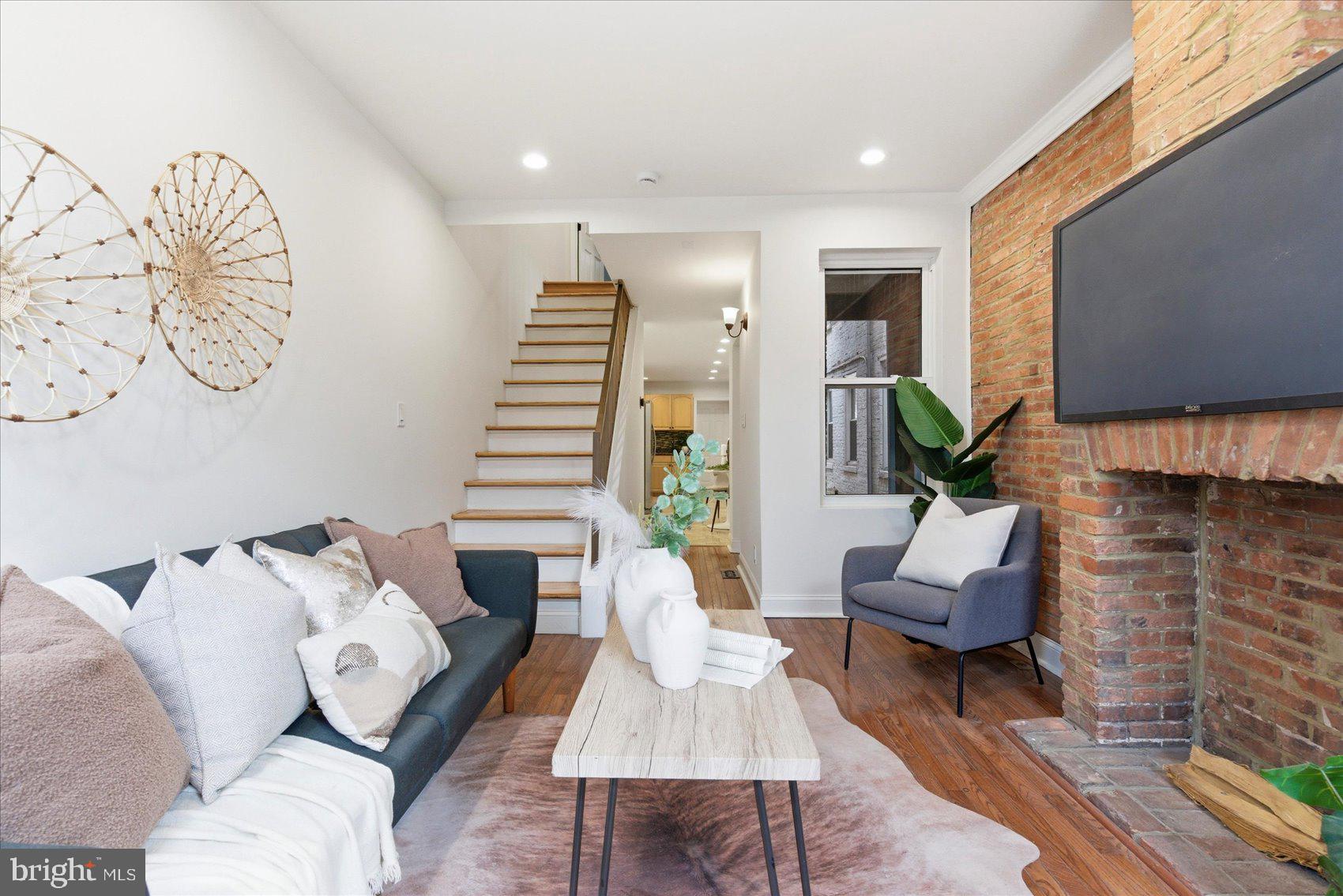 Beautifully renovated home just 3 blocks from the Square—an unbeatable location! This charming property is filled with character and natural light, featuring exposed brick, side windows, and recessed lighting throughout.

The main level offers a stylish kitchen with a breakfast bar, perfect for casual dining and entertaining. Upstairs, you’ll find two comfortable bedrooms, while the finished basement provides flexible space that can be used as a third bedroom, home office, or rec room (ceiling height approximately 6'6").

The primary bath features a luxurious soaking/jetted tub, creating a spa-like retreat. Step outside to enjoy the rooftop deck—ideal for relaxing or entertaining with city views.

A perfect blend of modern updates and classic charm in a prime location—don’t miss this one!