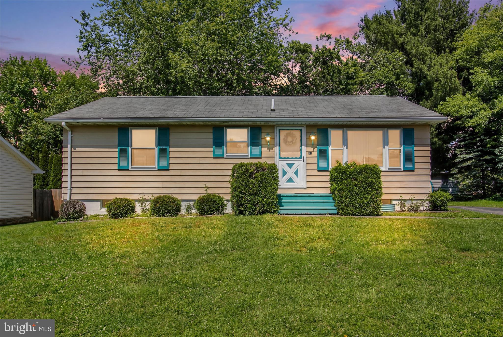 Cozy and Comforable!  Great home to get started or to Downsize too.   Large Family Room and Two Bedrooms on the First Floor with Full Bath.  Kitchen with Dining Area!  Downstairs is the Laundry and One Extra Room to use as an additional Bedroom or Recreation Room.  Perfect size close to schools and shopping!