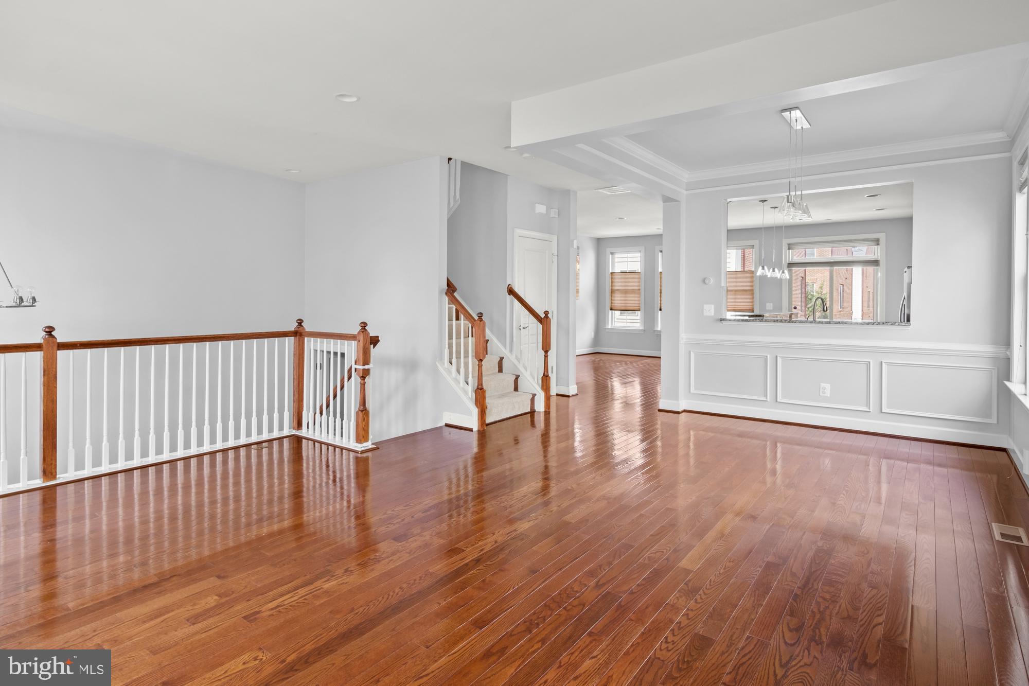 LUXURY end unit townhome walking distance from fabulous Shirlington Village! Enjoy a sun-filled open concept layout with high ceilings, gleaming hardwood flooring, and neutral paint colors! The bright main level offers open living and dining areas, family room w/ cozy gas fireplace, half bath, and a beautifully updated open kitchen featuring granite counters, stainless steel appliances, breakfast bar, and pendant lighting. The spacious upper level offers an expansive primary suite w/ walk-in closet and huge spa-like bathroom w/ double vanities, walk-in shower, and oversized soaking tub, as well as two generously sized bedrooms and an additional full bathroom. The walk-in lower level features a welcoming foyer and large fourth bedroom or office, third full bathroom, and convenient access to your own 2-car garage. Enjoy relaxing with friends on your private roof-top terrace! Unbeatable location near Shirlington, WOD bike trail, dog park, and just minutes from Clarendon, Ballston, and More!