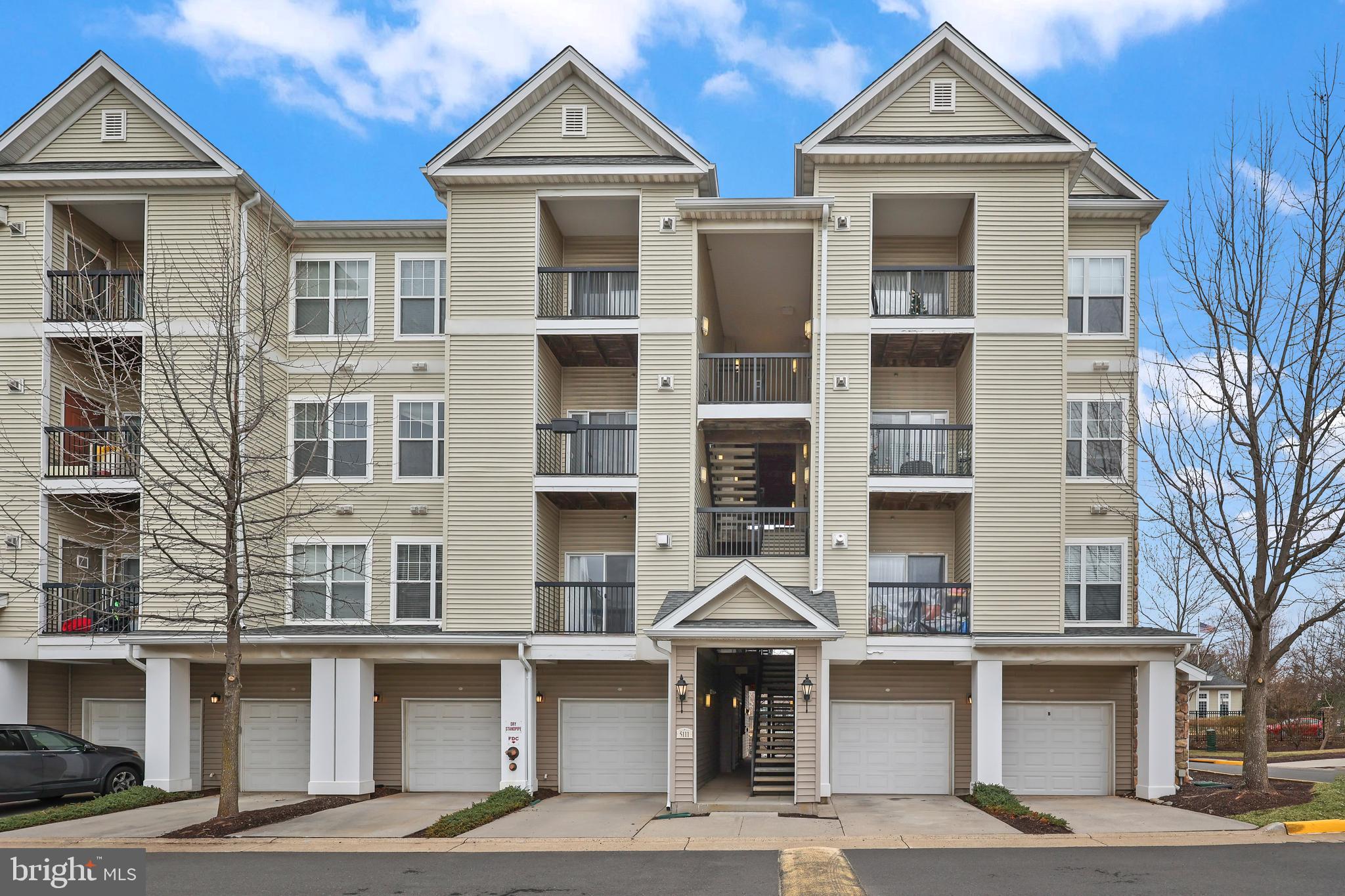 LOCATION! CONVENIENCE! COMFORT! This meticulously maintained 3-bedroom, 2 bathroom END UNIT condo with a RARE attached, same level, one car garage  in Centreville offers both comfort and convenience, in such an amazing location right in the heart of Northern Virginia. A kitchen that is a chef's dream- The modern kitchen features stainless steel appliances, gas cooking, beautiful backsplash and elegant granite countertops, making meal preparation a delight. An entertainer's and open concept lover's ideal kitchen-  A stunning granite peninsula anchors the kitchen, offering plenty of counter space for meal prep, a stylish backsplash, and a convenient overhang for barstool seating. The kitchen and living room flow delightfully together. The modern living area is perfect, with a spacious and airy layout, and the main-level  boasts luxury plank flooring throughout. Two additional bedrooms are located upstairs, providing ample space for family or guests. A recently installed water heater (July 2023), and an HVAC that just passed inspection, ensures peace of mind. Enjoy an attached private 1-car garage- offering secure parking and easy access, making tasks like carrying in groceries effortless. The driveway provides an additional parking space, accommodating a second vehicle comfortably. The upper-level laundry area offers ultimate convenience, making laundry day a breeze with a washer and dryer right where you need them. Residents can enjoy community amenities such as a clubhouse, fitness center, pool, common areas, and tot lot. The property is zoned for highly rated Fairfax County Public Schools, including Colin Powell Elementary, Liberty Middle, and Centreville High School. With easy access to Route 66 HOV lanes, the Stringfellow Park & Ride, and nearby shopping and dining options, this home is ideally situated for a vibrant lifestyle. This one won't last- schedule a showing today!