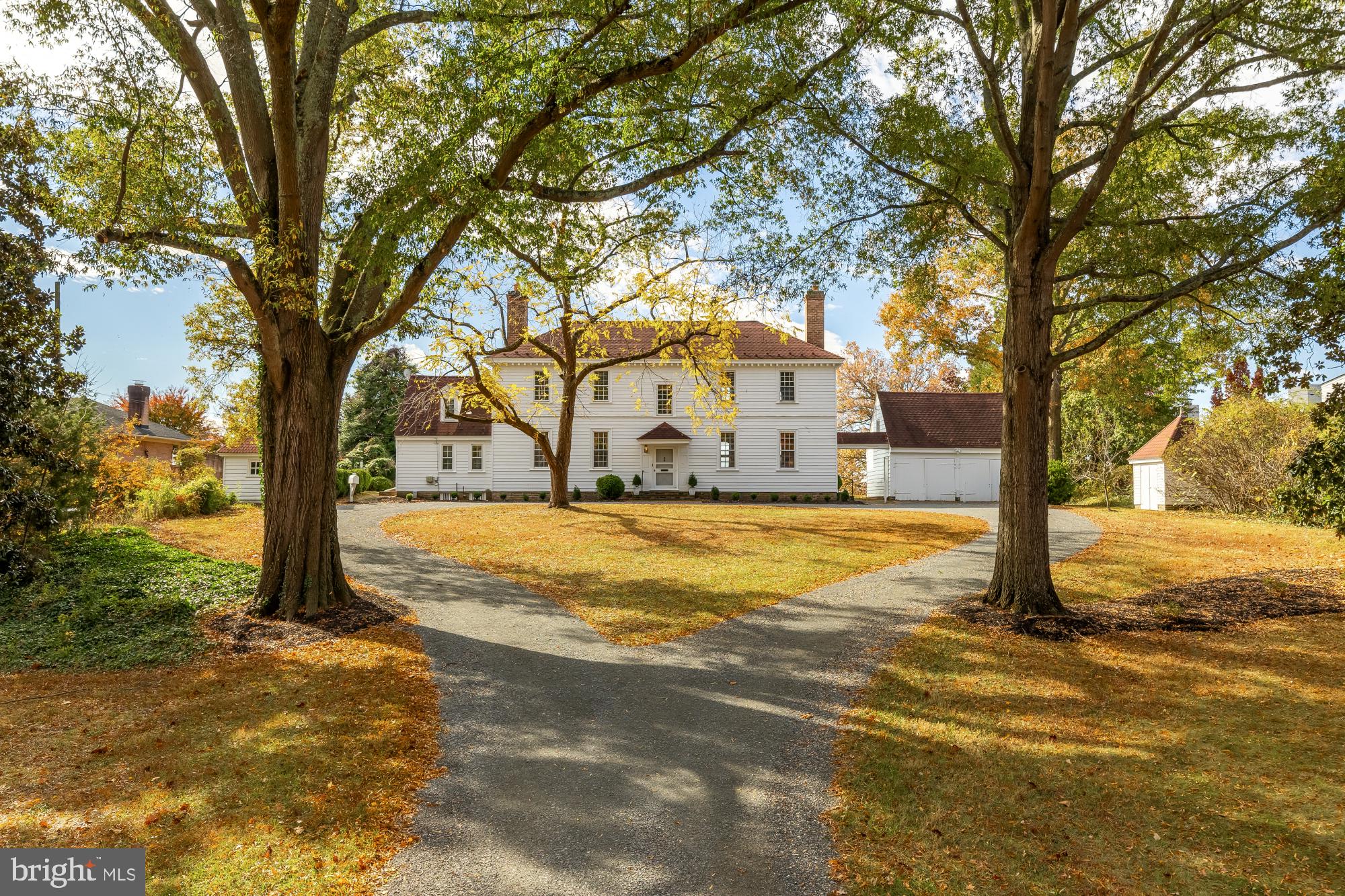 It’s rare that a home with such rich history, distinctive architecture, and an exceptional location becomes available to the public. Today, you're in for a special treat--a chance to explore an extraordinary residence that blends American history, timeless craftsmanship and endless potential! 
Once the boyhood home of General Winfield Scott--the legendary general who served in the War of 1812, the Mexican-American War, and the Civil War--this remarkable home began its story in 1762 in Sussex County, VA, known then as The Mitchell House. 
In 1946, it found new life when Carl W. Porter, Fairfax County's Director of Public Works and a retired U. S. Navy Captain along with his wife, Beatrice, carefully relocated it piece by piece to its stunning new site--a serene two-acre setting on the Potomac River, just below George Washington's Mount Vernon. They lovingly renamed it CARLBY! Washington’s 1793 map of the Mt Vernon Estate shows Carlby as “Field Number 1” and the water in front of the home as George Washington’s fishery.
Set back from the road and only 200 feet from the water's edge, this secluded 2.18 acre property is approached by a graceful lengthy driveway which is perfectly situated to reflect the symmetry of the home and its outbuildings. 
This elegant residence follows the grand tradition of Southern plantation design--with a wide central hall and front and back doors perfectly aligned to invite cool river breezes. As you step inside with both doors open, the view of the water unfolds before you in breathtaking fashion. 
The riverside facade can be admired from the stately portico, reminiscent of Mount Vernon's grand lawn. Whether hosting gatherings or savoring tranquil mornings by the water, the setting offers breathtaking views, timeless serenity and radiant sunsets. With 151 feet of beautiful water frontage and a pier extending into the river, the property presents endless possibilities for relaxation and recreation, all surrounded by a natural landscape that serves as a thriving habitat for local wildlife. 
Inside, the craftsmanship speaks for itself. The first floor showcases original wide-plank pine floors, soaring 12-foot ceilings, and beautifully preserved moldings and paneling. To one side of the main hallway lies the grand living room, adorned with intricate wainscoting and elegant woodwork restored by the Porters themselves. Expansive nine-over-nine windows fill the space with natural light and frame sweeping river views. Across the hall, the formal dining room features a stately fireplace and a custom chandelier designed by Captain Porter and inspired by one found in George Mason's home at Gunston Hall. A cozy den with its own full bath offers the versatility of a first-floor bedroom; each of these rooms features a beautifully detailed period fireplace. The galley kitchen, half bath, laundry area and a private staircase leading to an upstairs room complete the main level. 
Upstairs, the owner's suite spans the full width of the house--a peaceful retreat with original floors, an elegant wood burning fireplace and an en-suite bath. With views of both the front lawn and the river, it captures the quiet grace of the home's 18th century origins. Two additional bedrooms, a full hall bath and custom built-in closets round out the upper level--each space filled with charm and history, from river views to cozy fireplaces. A detached double garage with upper-level storage, a historic smokehouse, complementary shed complete the outside structures on the property; all arranged with balance & purpose. 
Carlby is more than a home---it's a living piece of American heritage. A place where history, architecture and nature converge in perfect harmony. For historians, architects, preservations and lovers of nature who are looking for a waterfront, private retreat on over 2 acres of land, the possibilities are endless. This is a once-in-a-lifetime opportunity to own something truly irreplaceable.
