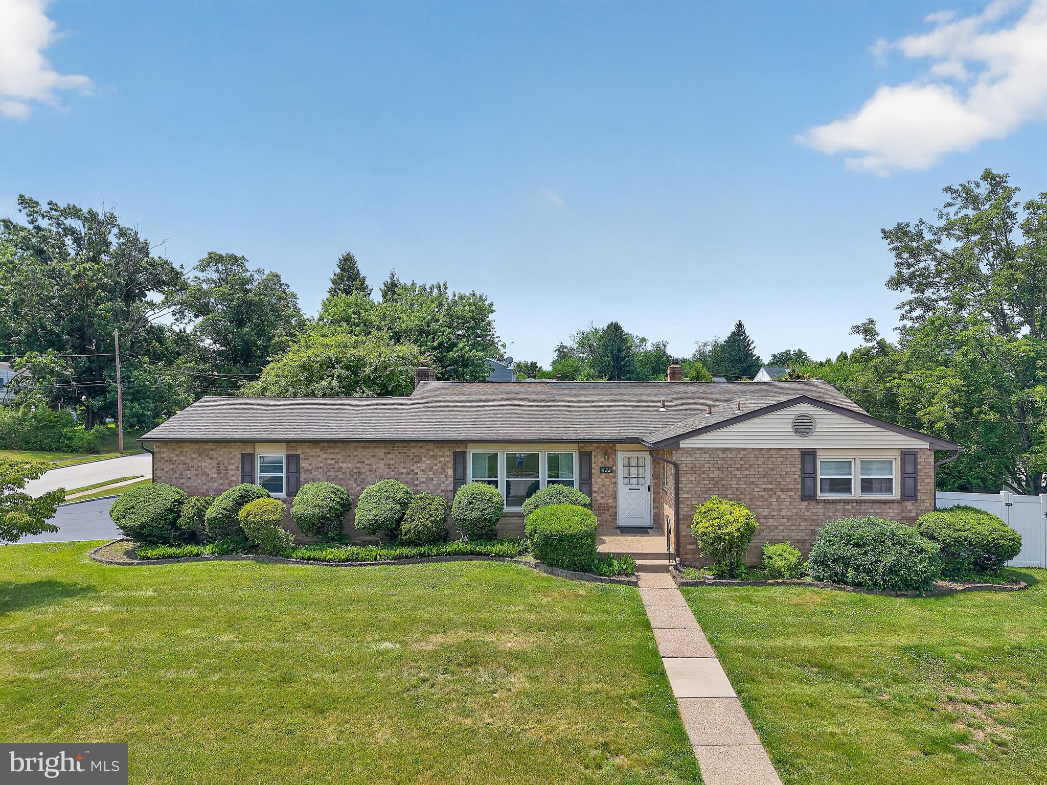 Welcome to 622 Apache Lane, where comfortable 1-floor living meets exceptional indoor and outdoor entertaining! Situated on a desirable corner lot in a wonderful neighborhood, this inviting ranch home offers an open floor plan designed for today's lifestyle. The spacious eat-in kitchen features abundant counter space, overhead lighting, and overlooks the expansive family room, where a beautiful brick fireplace serves as the focal point for gathering with family and friends. Hardwood floors lie beneath the carpeting throughout much of the main level, offering exciting potential for the next owner. The primary suite includes a ceiling fan and a private bath with a tub/shower combination. 2 additional generously sized bedrooms are served by a full hall bathroom. The finished basement provides even more living space and is currently configured as a game room, complete with a pool table that is included with the home. A convenient powder room, laundry area, and abundant storage space make the lower level as practical as it is enjoyable. Step outside and discover your own private backyard retreat. An oversized deck with a retractable awning overlooks the meticulously maintained in-ground sparkling  pool, creating the perfect setting for summer entertaining or simply relaxing at home. There are roof-mounted solar collectors that provide heating for the pool; these are solar thermal panels, not electricity-producing solar panels.   A storage shed, an attached two-car garage, and an extra-large driveway provide plenty of room for vehicles, hobbies, and storage. Conveniently located just minutes from the Pennsylvania Turnpike, I-476 (the Blue Route), Plymouth Meeting Mall, shopping, dining, parks, and everyday conveniences, this home offers the perfect blend of peaceful neighborhood living and easy access to everything you need. Best of all, the property is located within the highly regarded Colonial School District. Offering the convenience of 1-floor living, generous living spaces, an incredible backyard oasis, and an unbeatable location, 622 Apache Lane is ready to welcome you home!
