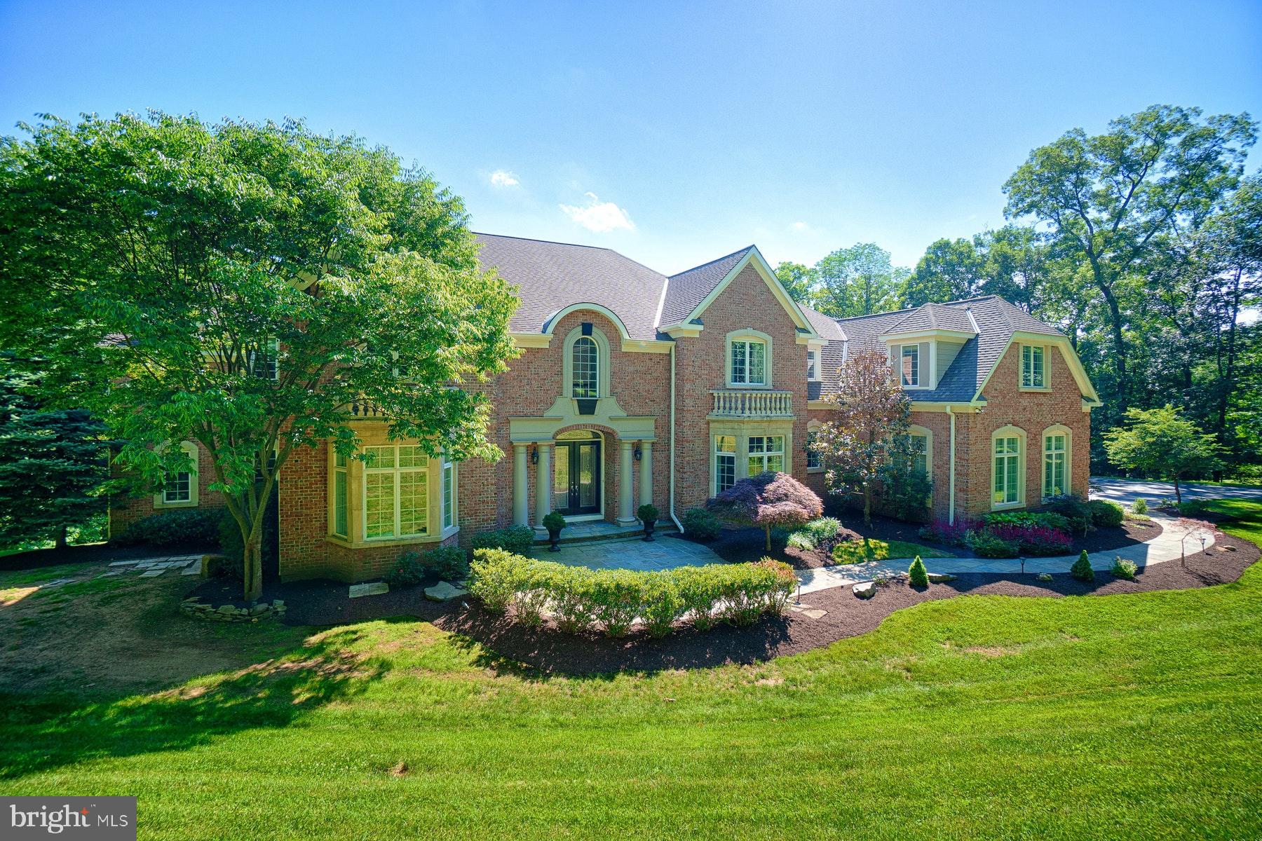 Welcome to your dream retreat! Nestled on a picturesque three-acre estate lot, this stunning Schultz custom home is surrounded by mature trees, offering unparalleled privacy and tranquility. The residence features a luxurious first-floor primary suite, which is complemented by an additional  primary suite upstairs, ensuring comfort and convenience for all. The recent basement renovation introduces a spacious bedroom, a sleek bath, a state-of-the-art workout room with glass doors, and a versatile craft/yoga room, perfect for all your wellness and creative pursuits. The heart of the home is the custom kitchen, adorned with high-end stainless steel appliances, designed for both the culinary enthusiast and the entertainer. Gather around one of the five fireplaces and create cozy moments in the two-story living and family rooms. Step outside to your personal oasis, where an infinity-edge pool offers a refreshing escape, surrounded by the natural beauty of the estate. This home effortlessly blends luxury with comfort, presenting an exquisite living experience that caters to your every need. Don't miss the opportunity to own this exceptional property, where elegance meets functionality in a serene, private setting.