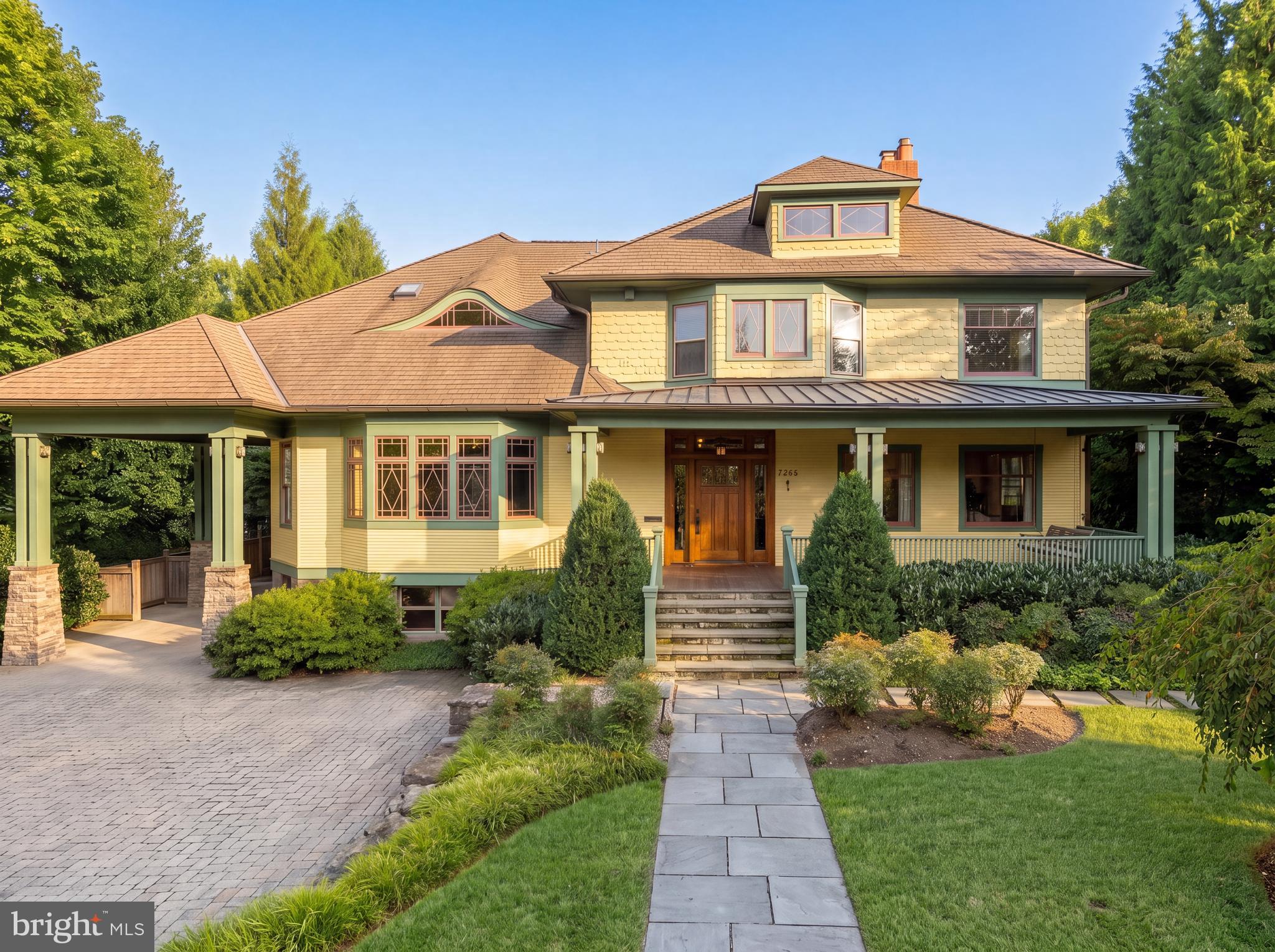 Nestled on a sprawling, level half-acre lot, along a verdant stretch in the heart of sought-after Chevy Chase Village Section Three, 3626 Raymond Street is the classic craftsman charmer. From the curbside, the home’s vibrant yellow shingle and green trimmed exterior radiates character amongst today’s cookie cutter residences. A low stacked-stone wall is bifurcated by a central flagstone walkway offering an elegant approach across the manicured front lawn, stepping up into the charming covered porch. Adjacent is a paver motor court offering ample surface parking in addition to a neatly integrated carport. The Hollywood film-worthy interiors continue the old-world ethos, with stunning, rich, intricate millwork throughout, showcasing a level of craftsmanship from a far bygone era. Meticulous curation has infused the century-old space with fully modern amenities to suit present-day lifestyle demands. The central foyer’s showpiece is the grand staircase, bent around an integrated bench and whose intricacy is peerless. Embassy-sized formal living and dining rooms flank the entryway in a traditional center hall configuration, setting the tone for deceptively grand spaces. The former features a roaring fireplace and two full exposures to natural light. The latter has a buffet cabinet built into the bay window sill, coffered ceiling, pinhole lighting to establish a sophisticated ambiance, and flows into a recessed library nook surrounded by built-ins. The main informal living area is the spacious family room, also featuring a wall of built-ins opposite a set of sliding doors opening onto the covered rear porch, an ideal setting for al fresco dining or entertaining. The family room is connected to the kitchen area by a spectacular transverse gallery, its floor-to-ceiling picture windows blurring the lines between indoor and outdoor living. A decidedly more modern space, the kitchen connects to the rest of the main level via a custom, fully wooden island with integrated seating, but introduces a commercial-grade Wolf range and state-of-the-art, full size refrigeration for the culinary enthusiast. An adjacent, ethereal breakfast nook and mudroom area complete the main level. A private study introduces the upper level primary suite, occupying a substantial portion of the home’s footprint. The bedroom is privately tucked away and enjoys lush views from a wall of glass, while the dressing area comprises three walk-in closet areas on dual levels. In stark contrast, the primary bath is lavishly clad in Calacatta marble and generously equipped with dual inset vanities, a separate full powder room, freestanding clawfoot tub, walk-in shower enclosure, and Waterworks fixtures. Completing the upper level are a bedroom suite, two additional bedrooms sharing a hall bath, and a convenient laundry room. Two additional bedrooms, easily repurposed as bonus spaces, a full bath, and a communal sitting area are found on the top level. The self-sufficient lower level intertwines leisure and function with a recreation room, kitchenette, bedroom, full bath, and second laundry room, while a private office wing opposite spans the entire depth of the home. Another highlight of the home is the outdoor space, also deceptively large. The expansive paver patio, stepped down from the covered porch, is dominated by a sprawling 60-foot heated pool with automatic cover.