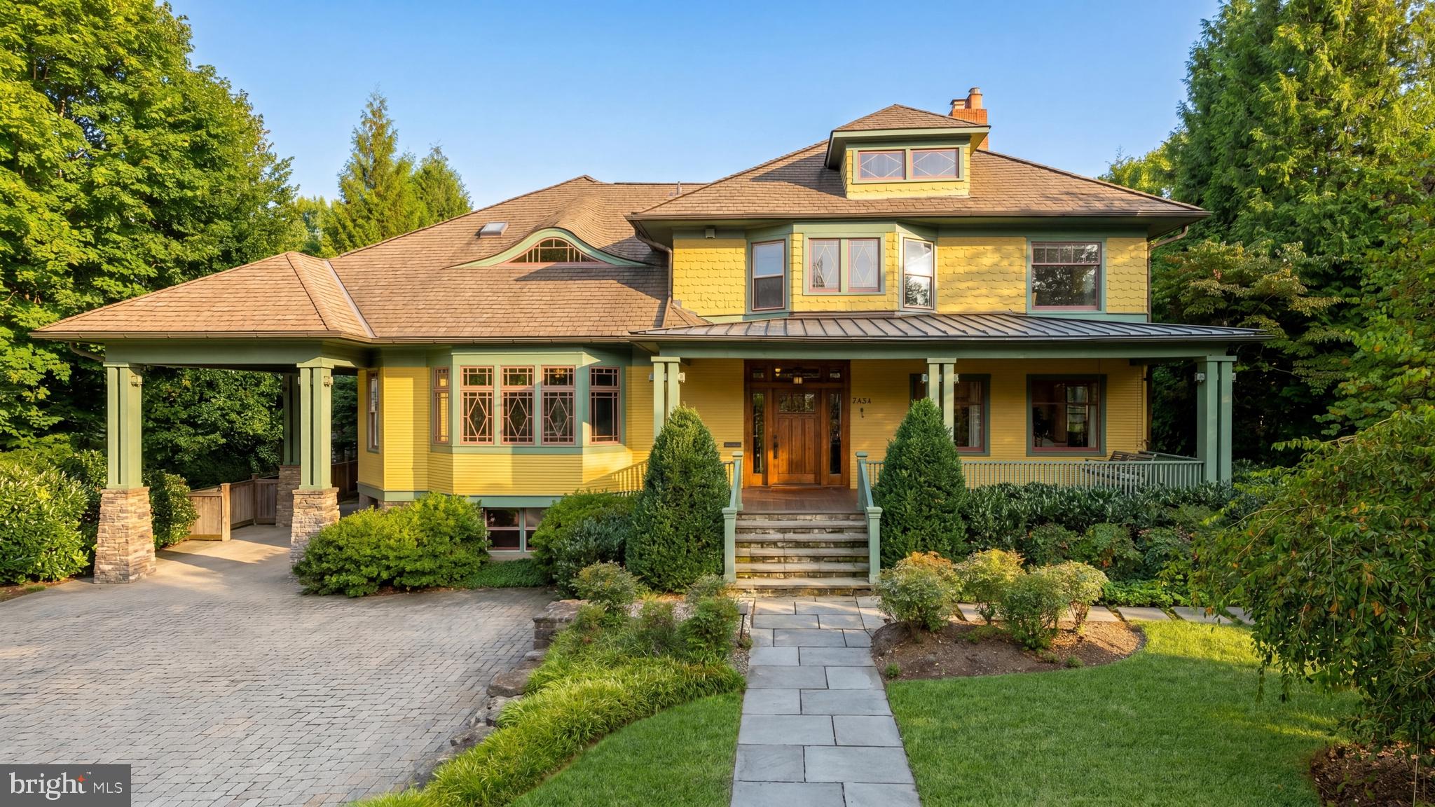 Nestled on a sprawling, level half-acre lot, along a verdant stretch in the heart of sought-after Chevy Chase Village Section Three, 3626 Raymond Street is the classic craftsman charmer. From the curbside, the home’s vibrant yellow shingle and green trimmed exterior radiates character amongst today’s cookie cutter residences. A low stacked-stone wall is bifurcated by a central flagstone walkway offering an elegant approach across the manicured front lawn, stepping up into the charming covered porch. Adjacent is a paver motor court offering ample surface parking in addition to a neatly integrated carport. The Hollywood film-worthy interiors continue the old-world ethos, with stunning, rich, intricate millwork throughout, showcasing a level of craftsmanship from a far bygone era. Meticulous curation has infused the century-old space with fully modern amenities to suit present-day lifestyle demands. The central foyer’s showpiece is the grand staircase, bent around an integrated bench and whose intricacy is peerless. Embassy-sized formal living and dining rooms flank the entryway in a traditional center hall configuration, setting the tone for deceptively grand spaces. The former features a roaring fireplace and two full exposures to natural light. The latter has a buffet cabinet built into the bay window sill, coffered ceiling, pinhole lighting to establish a sophisticated ambiance, and flows into a recessed library nook surrounded by built-ins. The main informal living area is the spacious family room, also featuring a wall of built-ins opposite a set of sliding doors opening onto the covered rear porch, an ideal setting for al fresco dining or entertaining. The family room is connected to the kitchen area by a spectacular transverse gallery, its floor-to-ceiling picture windows blurring the lines between indoor and outdoor living. A decidedly more modern space, the kitchen connects to the rest of the main level via a custom, fully wooden island with integrated seating, but introduces a commercial-grade Wolf range and state-of-the-art, full size refrigeration for the culinary enthusiast. An adjacent, ethereal breakfast nook and mudroom area complete the main level. A private study introduces the upper level primary suite, occupying a substantial portion of the home’s footprint. The bedroom is privately tucked away and enjoys lush views from a wall of glass, while the dressing area comprises three walk-in closet areas on dual levels. In stark contrast, the primary bath is lavishly clad in Calacatta marble and generously equipped with dual inset vanities, a separate full powder room, freestanding clawfoot tub, walk-in shower enclosure, and Waterworks fixtures. Completing the upper level are a bedroom suite, two additional bedrooms sharing a hall bath, and a convenient laundry room. Two additional bedrooms, easily repurposed as bonus spaces, a full bath, and a communal sitting area are found on the top level. The self-sufficient lower level intertwines leisure and function with a recreation room, kitchenette, bedroom, full bath, and second laundry room, while a private office wing opposite spans the entire depth of the home. Another highlight of the home is the outdoor space, also deceptively large. The expansive paver patio, stepped down from the covered porch, is dominated by a sprawling 60-foot heated pool with automatic cover.