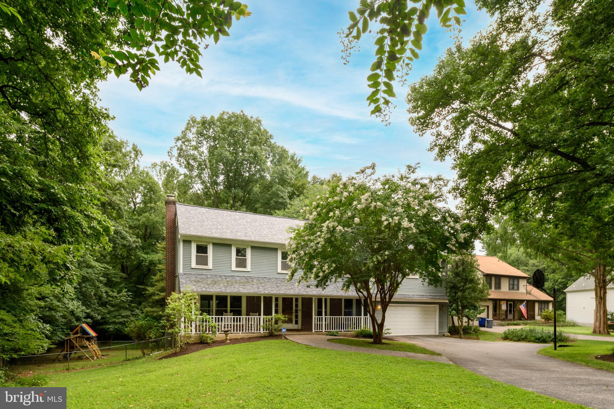 Location, location, location! This beautiful 5 bedroom 2 full + 2 ½ baths, 2 car oversized garage colonial in Hammond Village backs and sides to woods, with a Cul-de-sac location in the Atholton High School district!  The main level has hardwood floors throughout, a powder room, a completely renovated kitchen that is open to the family room and dining room with Silestone countertops, upgraded cabinetry, stainless appliances including a double oven and an eat-in area.  The family room has a wood burning fireplace with built-ins on both sides as well as deck access off the rear.  Hardwood floors continue up the stairs and through the upper hall leading to the primary bedroom which is genuinely huge with ceiling fans, 2 closets, a makeup area and an ensuite bathroom.  4 additional bedrooms (5 total) and 2 linen closets complete the upper level as well as an updated hall bathroom.  The walkout lower level is completely finished with a large great room, a full wet bar as well as an additional ½ bath.  The secluded backyard is like its own small retreat, with 3 tiered decks, a fish pond with a waterfall and is surrounded by trees for ultimate privacy.  Out front you will find stamped concrete sidewalks leading to the front porch, a large driveway with ample parking and basketball area as well as several garden areas.  Other updates include HVAC system replaced inside and out in 2018, roof replaced in 2024, and a new EV charger line add in the garage.  Located in a sought-after community with fantastic amenities including swimming pool access and sports courts, and is just minutes from shopping, dining, entertainment, and major commuter routes, this home truly has it all!  Both Hammond Elementary and Middle schools are in the community. Note: the community Hammond Pool Club is a private pool that offers memberships and swim teams if you want to check it out. Minutes to APL, Maple Lawn, Ft Meade/NSA. Minutes to I95, Rt 29 and Rt 32. All of this is why the location has always been so popular! Don't wait! Call your agent for a private tour today!