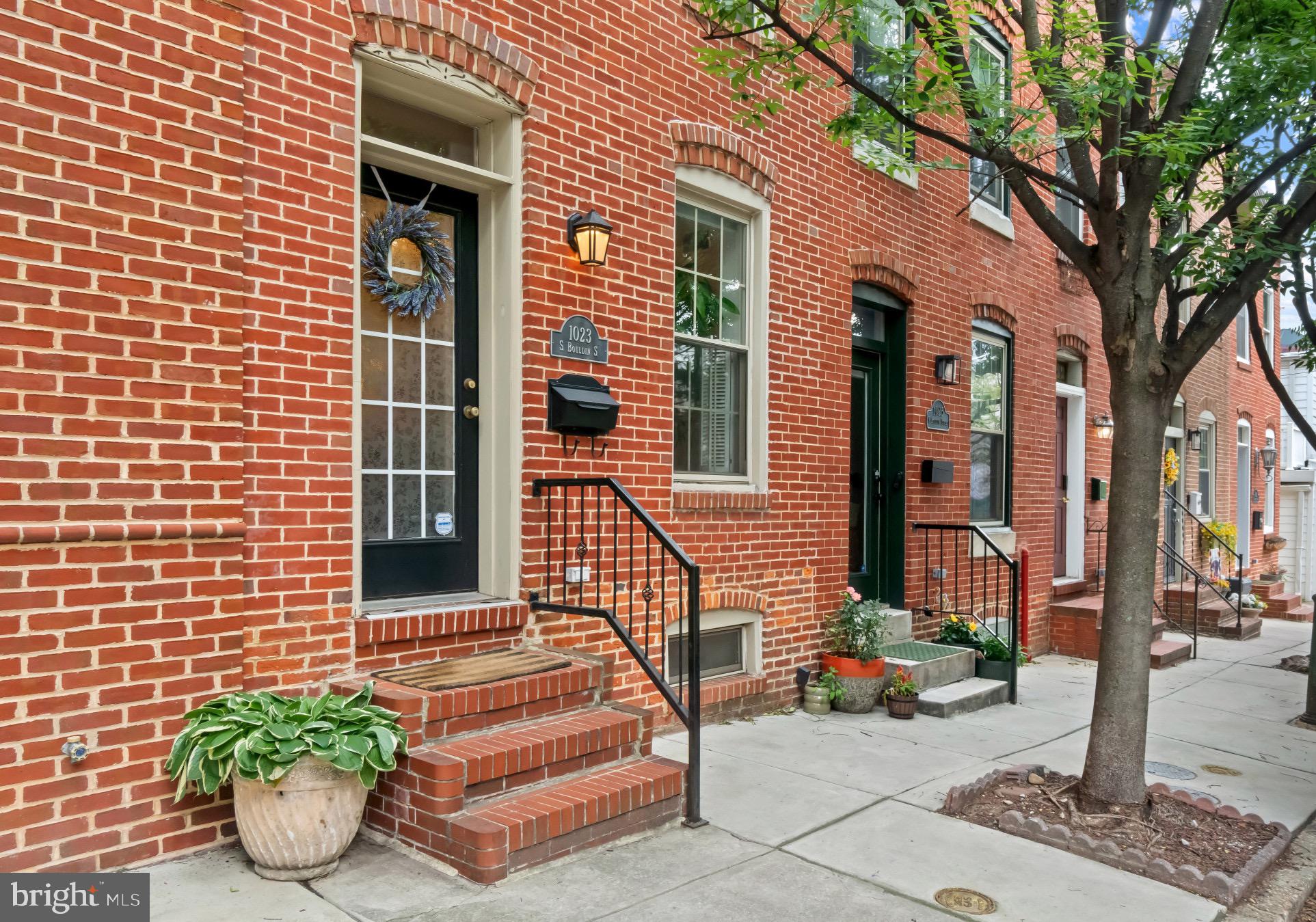 Welcome to one of Canton's most coveted blocks! This uniquely spacious rowhome offers nearly 2,000 square feet of thoughtfully designed living space - an impressive footprint for the neighborhood. The hardwood floors, exposed brick walls, soaring vaulted ceilings, cozy fireplace, multiple skylights, and abundant natural light give this home a warm, inviting feel throughout. The open layout flows beautifully, while the fully finished basement adds exceptional flexibility: perfect as a 3rd bedroom, home office, or family/entertainment room (without sacrificing room for storage - which there's loads of!). Step outside to your two-tiered rooftop deck and take in the views. A new roof (2026) and private parking pad round out this turnkey package. All of this just minutes from Canton Crossing, I-95, and everything the neighborhood has to offer. Don't miss this one! OPEN HOUSES THURSDAY 6/25 & SATURDAY 6/27!