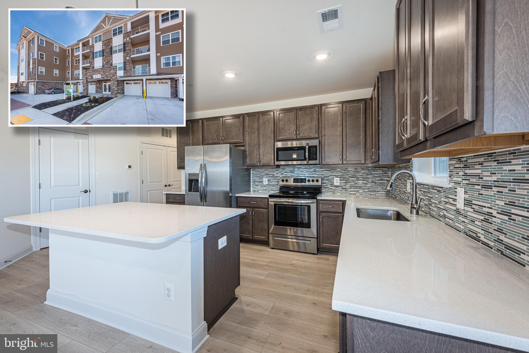 IMMEDIATE DELIVERY!  INCREDIBLE OPPORTUNITY TO LIVE IN THIS PRACTICALLY NEW DARLINGTON MODEL CONDO AT THE OVERLOOK AT BULLE ROCK!  Resort style living can be yours!  This 2nd floor unit offers 1,864 sq. ft. of living space and features an open floor plan with wood laminate flooring, a spacious living room with a separate dining area, designer island kitchen with ss appliances, Quartz counters, & ss appliances, 2 generously sized bedroom suites with walk-in closets and full baths, a separate office/study, convenient half bath, and a dual entry balcony.  This unit also comes with a 1 car garage and separate secure storage space.  Community amenities can't be beat - an incredible club house with a pool, tennis courts, and billiard room, community walking/jogging paths, and convenient to downtown Havre De Grace and minutes from Bulle Rock Golf Course!