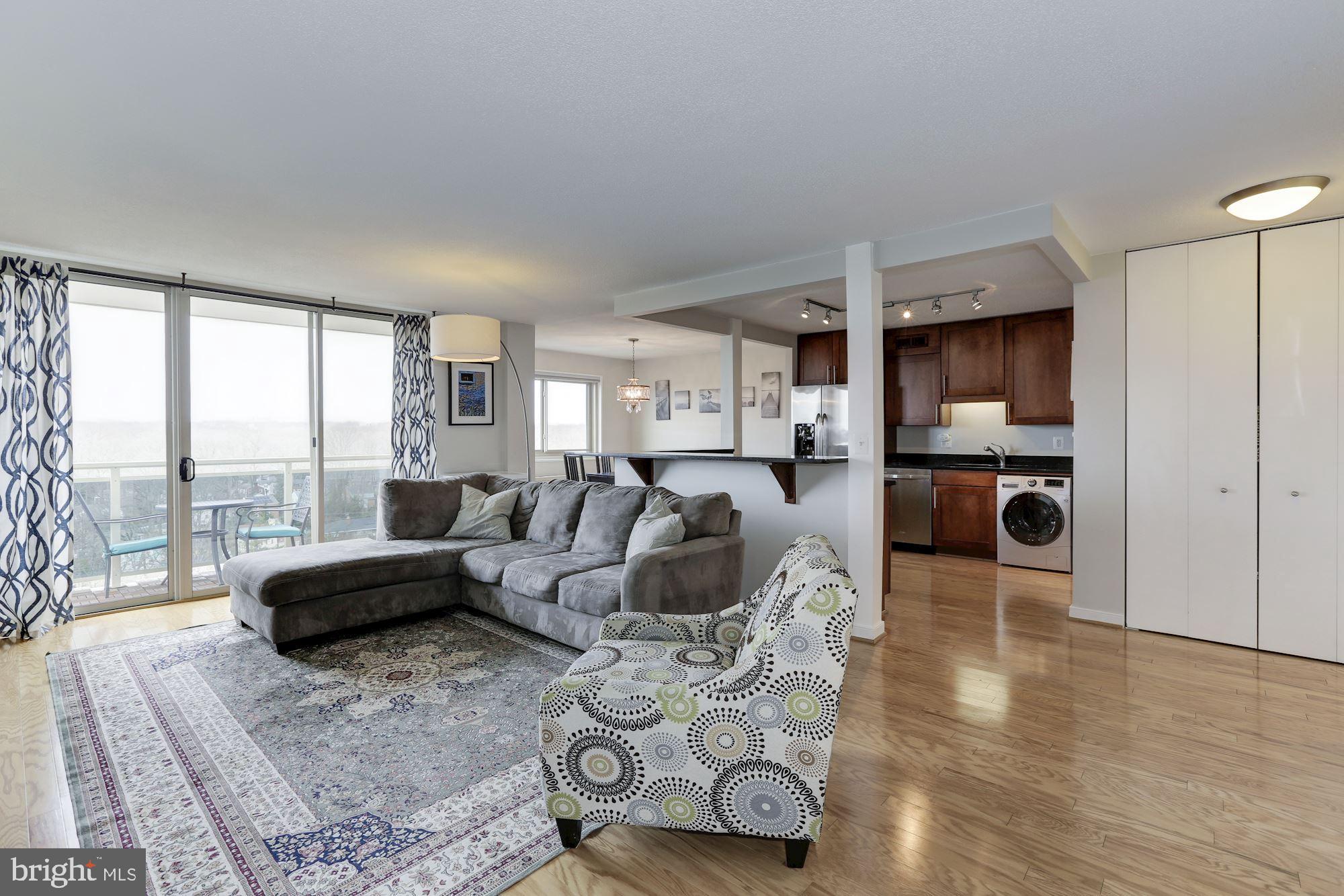 Welcome to Takoma Overlook, a conveniently located condo with amenities galore!   Unit 1112 is a bright and spacious two bedroom, two bath home with an open layout, in-unit washer and dryer, and private balcony with gorgeous sunset views for miles.  This unit was customized with hardwood floors throughout, granite countertops and stainless steel appliances in the kitchen and custom window coverings.   A monthly fee of $656.00 covers ALL utilities (water, electric, gas), an on-site property manager, and access to the complex amenities, including pool, tennis courts, fitness center, picnic area, and dog park.  The location is in the heart of Takoma Park, and close to the upcoming Purple Line.  One surface parking space conveys with the unit and guest parking is a breeze!  Rental storage is available and pets are welcome!