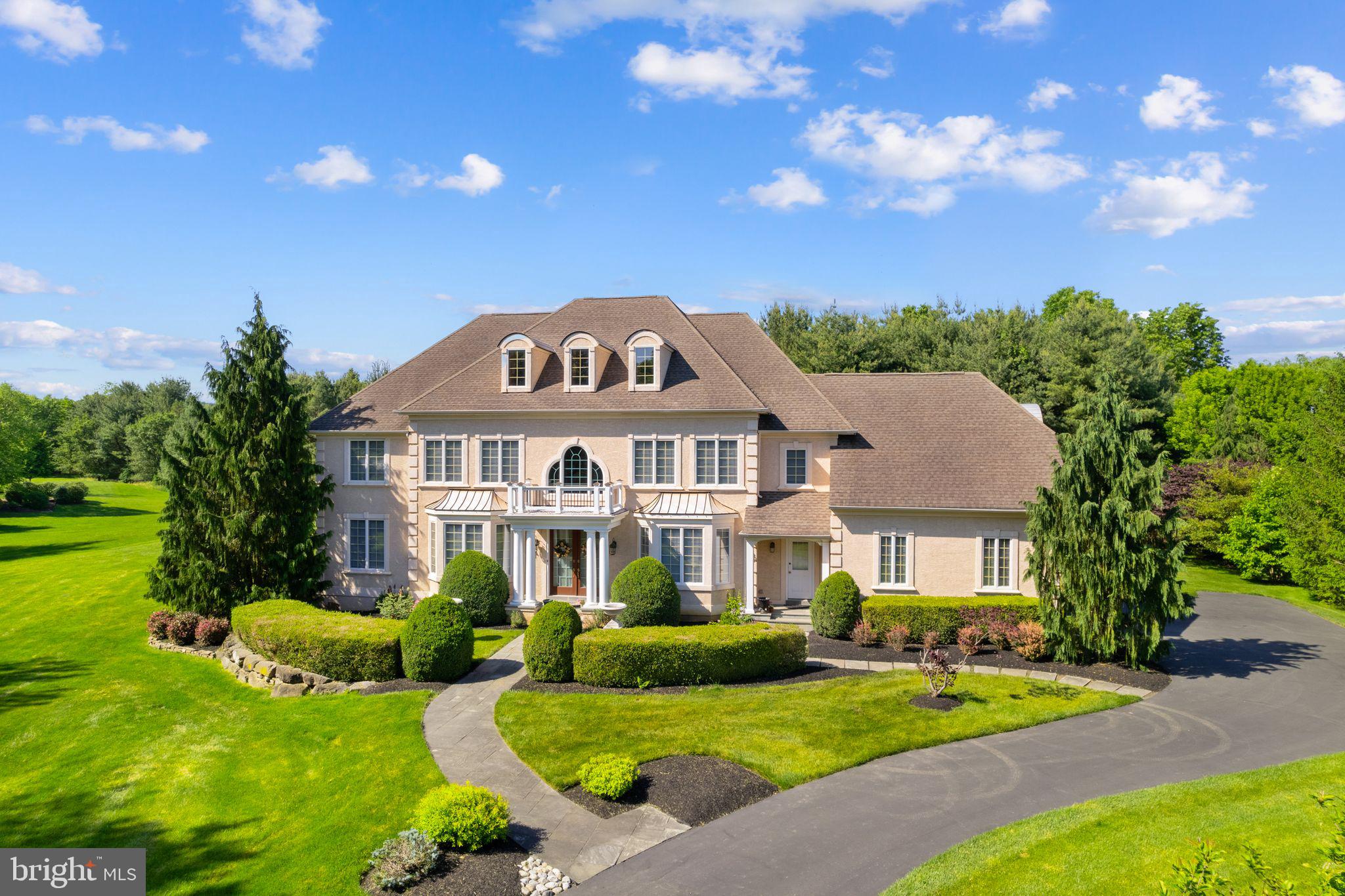 Welcome home to 2209 Corson Lane. This exquisite Georgian-style residence exudes elegance and sophistication. Its classical architecture of beautiful symmetry is enhanced by columns, arches, spacious rooms, and high ceilings. As you enter the gracious 2-story Foyer you are greeted by arched doorways and a wonderful color palette that is true to the Georgian period. The formal Living Room has a stunning faux marble gas fireplace, and pocket doors to a rich toned study with built in cherry bookcases. The Formal Dining Room with its beautiful moldings and Bay window is the perfect spot for sit-down dinners.  Moving past the turned staircase is the grand Great Room made the more spectacular by its central and ornate gas fireplace and floor to ceiling windows that flood the room in light. The kitchen is a chef’s delight featuring Wolf range, Subzero refrigerator, Asko dishwasher, Dacor oven and warming tray, microwave, and range hood. It is enhanced with beautiful cabinets, countertops, backsplash, and a large island that seats four and is an ideal gathering spot. A Butler’s Pantry makes formal entertaining a breeze with an extra sink, wine frig and wine racks. Upstairs offers a wonderful retreat. The primary Bedroom is complete with a large sitting room, 3 closets (1 large walk-in) and a spa like bath with dual sinks and vanities, jacuzzi tub and updated shower with rain shower head creating the feel and sound of a gentle summer rain. There is a lovely en-suite Bedroom and two additional Bedrooms with a shared Hall Bath. All Bedrooms have ceiling fans and gleaming hardwood floors. The walkout lower level is unfinished with high ceilings, rough-in for a bath and endless opportunities. There are many newer mechanicals: HVAC (2), Water Heaters (2), Sump Pump, and Whole House Generator. Outside, enjoy the privacy of this beautifully landscaped one acre lot. Located on a bucolic country road yet minutes to New Hope, Doylestown and all that Bucks County has to offer. Blue Ribbon Central Bucks Schools and an easy commute to NJ, Philly, or NYC.
