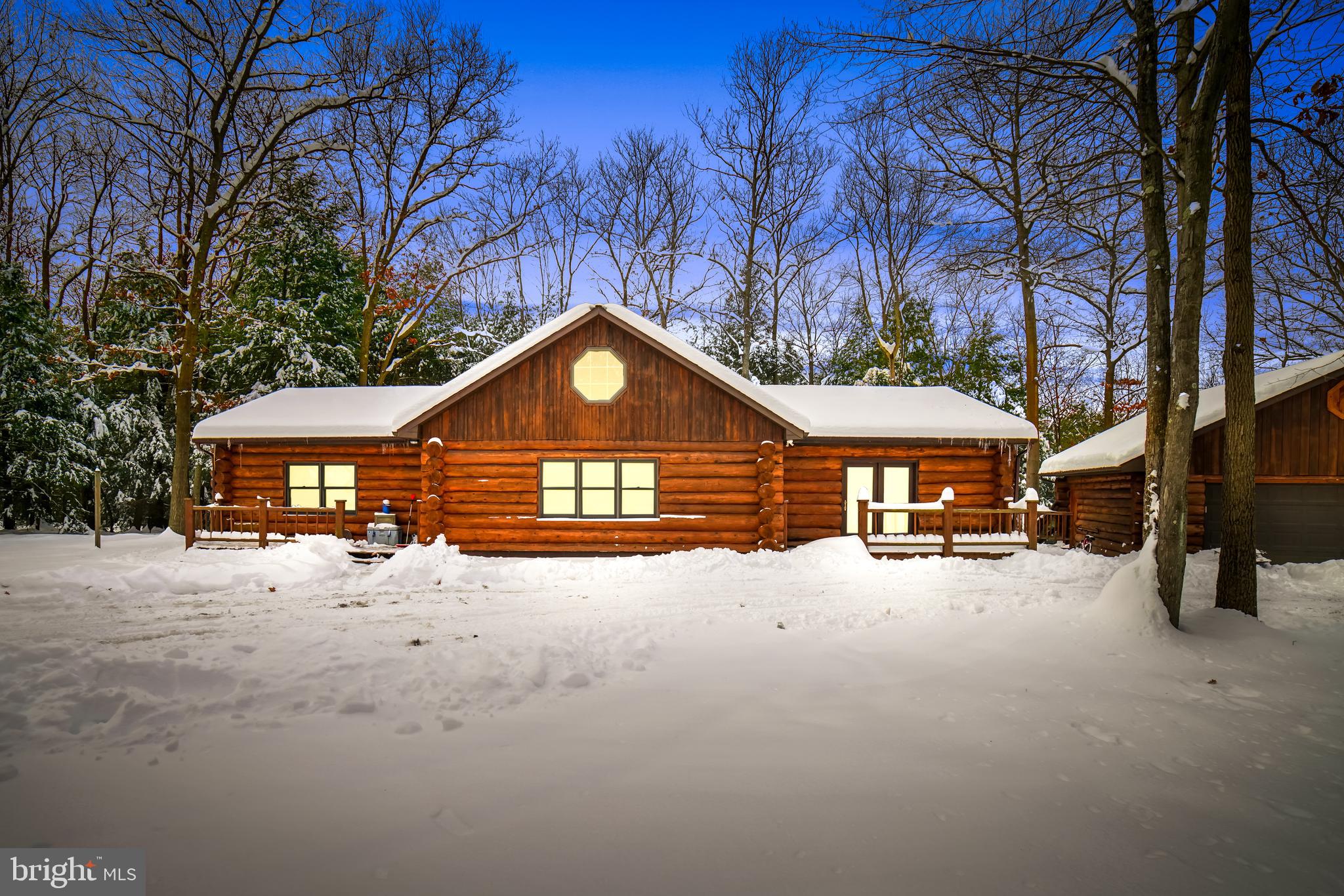 Gorgeous log cabin home situated on just over 2.8 acres. This 3 bedroom, 2 bathroom home features a large detached garage, stainless steel appliances, front and back decks, new flooring, and an open floor plan. Schedule a showing today!