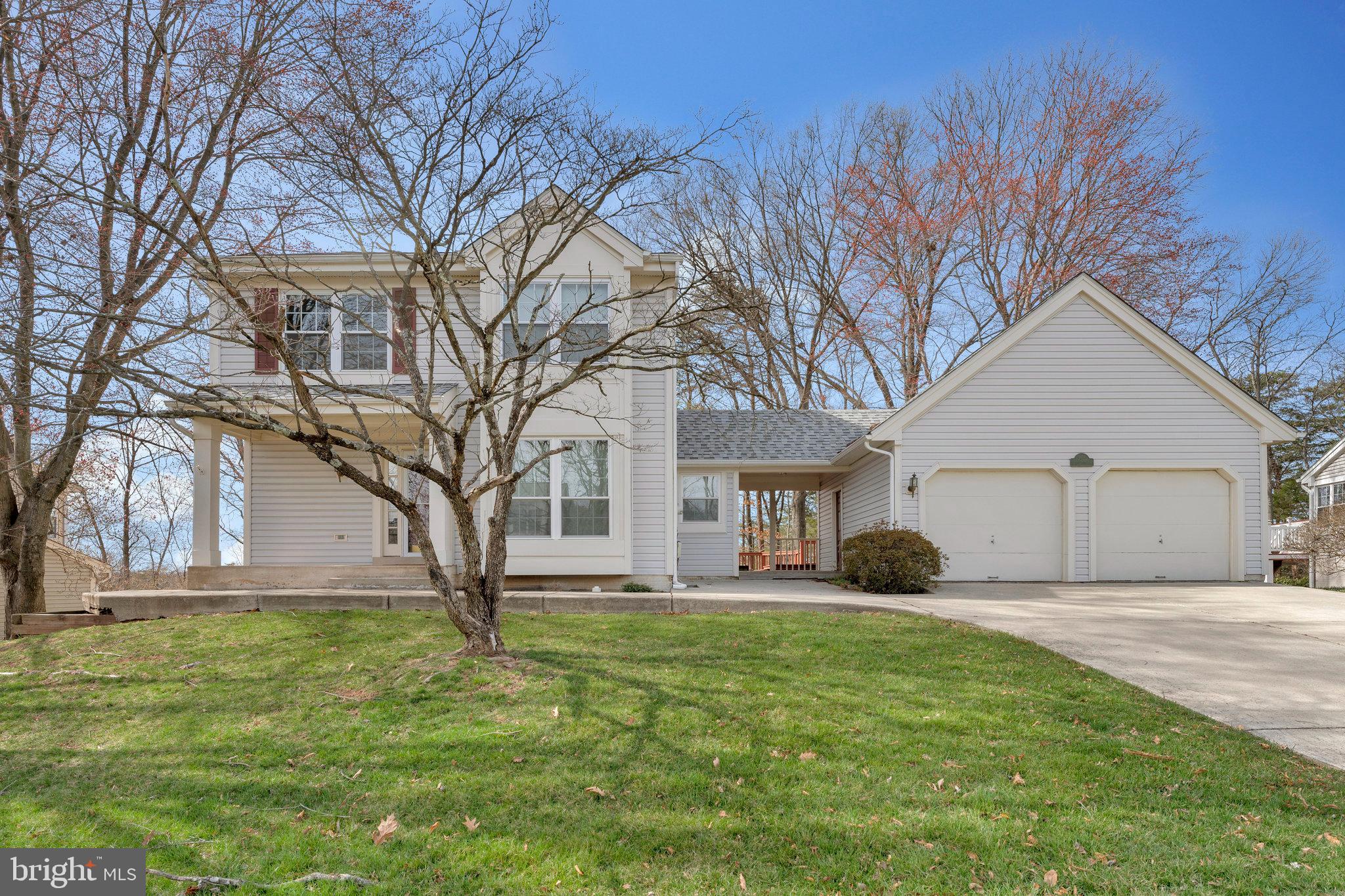 Welcome to this beautifully maintained and updated single-family home, offering the perfect blend of comfort, style, and privacy. Nestled in a serene setting backing to trees with views of the lake, this home provides a peaceful retreat while still being conveniently located near everything you need.

Step inside to discover an open-concept floor plan filled with tons of natural light, accentuated by hardwood and luxury vinyl plank flooring throughout. The main level features a spacious office/den, perfect for working from home or an additional living space. The heart of the home is the inviting living and dining area, seamlessly flowing into the kitchen—ideal for both everyday living and entertaining.

Upstairs, the primary suite boasts vaulted ceilings, creating an airy and relaxing retreat. Two additional bedrooms provide ample space, and the fully finished walk-out level basement adds even more versatility with a large storage room, a spacious laundry room, and additional living or recreational space.

Outdoor living is just as impressive! The huge deck with stairs leads to a sprawling, fenced-in backyard, perfect for entertaining, play, or simply unwinding in your private oasis. Plus, enjoy direct access to the lake, offering a truly rare and tranquil setting.

Completing this exceptional home is a detached 2-car garage, providing ample parking and storage.

Major Updates & Improvements:
- Roof (2015) – Transferrable Warranty until 11/18/2055
- HVAC (September 2023) – 10-Year Manufacturer Warranty
- Hot Water Heater (October 2020) – 6-Year Manufacturer Warranty
- First-Floor Windows (May 2019) – Transferrable Lifetime Warranty
- Second-Floor Windows (March 2020) – Transferrable Lifetime Warranty
- Chimney Cover Repair (October 2019)
- Kitchen Renovation (2019)
- Interior Paint (March 2025)
- Deck Paint (March 2025) 

Don't miss this incredible opportunity to own a home that combines modern updates, breathtaking nature views, and private lake access.
