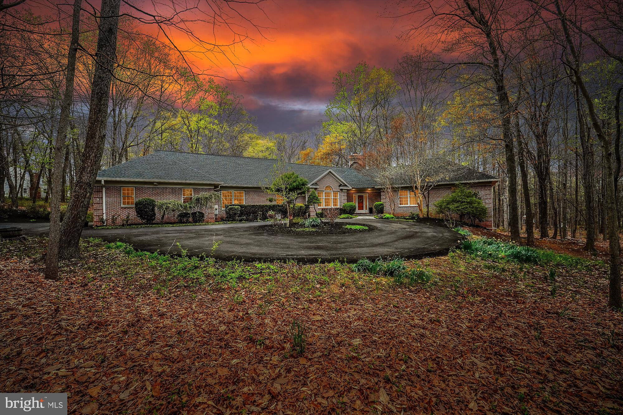 Discover an extraordinary sanctuary where luxury seamlessly blends with serene tranquility!  ** This ONE-OF-A-KIND Estate, nestled on a 3.14-acre surrounding mature trees offers an unparalleled private oasis. ** Imagine relaxing on your screened-in porch, enjoying the in-ground pool and entertaining on the deck. This is MORE than a house- it’s a Lifestyle! ** This meticulously crafted 6-bedroom, 5-bathroom home boasts over 5,000 square feet of thoughtfully designed living space, showcasing over 200K in upgrades. ** The impressive floor plan is designed to cater to every lifestyle and for entertaining large groups. ** Upon entering, you’re greeted by a GREAT Room bathed in natural light, featuring warm hardwood flooring, a tray ceiling, recessed lighting, a cozy wood burning fireplace and a casual dining area. ** An adjacent library nook with custom built-ins offers a sophisticated second seating area. ** The culinary stage awaits in the Chefs kitchen equipped with its 6- burner Viking gas range with 36” oven, separate double ovens, 20 cu ft. SUB ZERO refrigerator and separate Sub-Zero freezer, 2 sinks, and large island with breakfast bar. ** This space flows seamlessly into a formal dining room with lots of natural light and a cathedral ceiling, perfect for hosting elegant gatherings. ** The main level offers exceptional convenience with four bedrooms and three and half bathrooms. ** The primary suite is a private retreat, featuring a spa-like bathroom with a freestanding tub, a large floor-to-ceiling double shower with a custom door, a skylight, double sinks and a versatile walk-in closet/dressing room. ** A private office/additional bedroom is also included within the primary suite wing. ** On the opposite wing, a spacious princess suite and an additional 2- bedrooms with a hall bath provide ample space for family and guests. ** A mudroom and laundry area lead to the oversized 4-CAR side-load garage with a workshop. ** The lower level is a true gem, featuring a COMPLETE in-law/au pair apartment with a bedroom, full bath, dining/living area, kitchenette and private access offers even more versatility. ** PLUS, there is a separate spacious studio apartment with full bath, access to a kitchenette and its own walk-out private door. ** IMAGINE THE IMMENSE OPPORTUNITIES FOR THIS SPACE!! ** A cozy recreation/family room provides additional living space and there are two sizable storage areas for all of your organizational needs. ** Located in the desirable Big Woods neighborhood, this home offers easy access to shopping, dining and entertainment options, including the Village at Leesburg, Leesburg Corner Premium Outlets and Historic Downtown Leesburg. ** Enjoy the convenience of nearby transportation routes with Rt. 7, the Dulles Greenway and Dulles International Airport just minutes away. ** Don’t miss the opportunity to own a piece of paradise in a coveted location with NO HOA!  Schedule your private tour today!