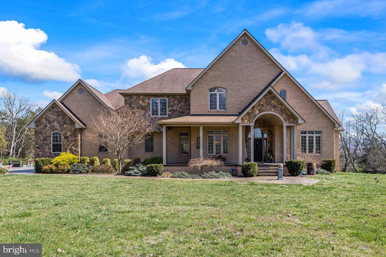 Welcome to this stunning, large brick home nestled on nearly three private acres in the heart of the country. Enjoy breathtaking views and ultimate privacy in this beautiful retreat. The home boasts a spacious floor plan with a grand family room featuring soaring ceilings, creating an inviting atmosphere for relaxation and entertaining. The chef’s kitchen is a dream, offering a large island, ample counter space, and modern finishes perfect for culinary enthusiasts. The luxurious master suite is conveniently located on the main level for easy access. Step outside to your own personal paradise with an in-ground saltwater pool, ideal for enjoying warm weather or entertaining guests. The large unfinished basement provides endless potential for customization, while the three-car garage offers plenty of space for vehicles and storage. This property is the perfect blend of comfort, elegance, and country living. Don’t miss the chance to make this your forever home!