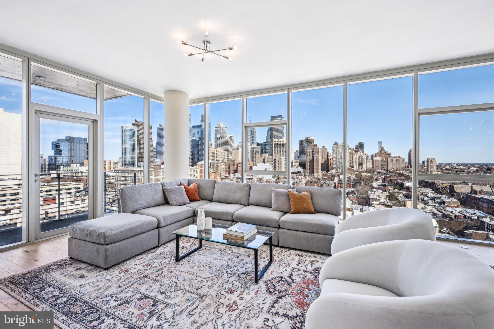 Discover unparalleled city living in this rarely available 02-floor plan at One Riverside, one of Philadelphia’s premier luxury condominium buildings in the heart of Fitler Square. This expansive 4-bedroom, 4.5-bath home spans nearly 2,600 sq ft, offering breathtaking panoramic views of the Schuylkill River, FMC Tower, and the Philadelphia skyline. With a bright, open layout and two private terraces, this residence is designed for both sophisticated entertaining and effortless everyday living.
The spacious living and dining area is enhanced by 10' ceilings, wide-plank walnut flooring, new lighting fixtures, and custom cabinetry, creating an elegant yet inviting atmosphere. Floor-to-ceiling windows flood the space with natural light, while a north-facing terrace provides a serene outdoor retreat. A true chef’s kitchen boasts Sub-Zero appliances, marble countertops, a Miele wine refrigerator, and a built-in wall oven with a microwave.  

The primary suite is a private sanctuary featuring a large sitting area, two walk-in closets with custom built-ins, and a spa-inspired marble bathroom with an oversized infinity whirlpool tub, a spacious stall shower, and a double vanity. The second bedroom includes an en-suite marble bath with a stall shower and ample storage, while the fourth bedroom, currently used as a home office, is outfitted with custom wood bookshelves and showcases stunning views of the river, bridges, and Art Museum. A laundry room with generous storage adds convenience to this thoughtfully designed home.

This residence also benefits from 2 years remaining on the tax abatement and valet parking for two cars. One Riverside offers an exceptional suite of full-service amenities, including 24-hour concierge and valet parking, a heated indoor 60' lap pool, a state-of-the-art fitness center with Peloton bikes, locker rooms with saunas, steam rooms, and showers, a chauffeur-driven town car, a catering kitchen, a boardroom, a guest suite, and a private landscaped park with an outdoor patio and grill.

Located just steps from the Schuylkill River Trail, this prime location provides easy access to University City, top hospitals, Rittenhouse Square, 30th Street Station, and Center City’s best restaurants and shopping.
Don’t miss this rare opportunity to own one of One Riverside’s most coveted residences—schedule your private showing today.