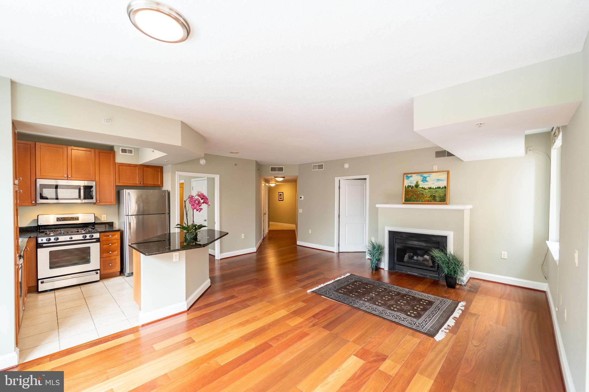 "Best of Ballston" Gorgeous mahogany floors, Open floor plan! Great Room w/ cozy gas Fireplace,  2 "private" primary bedrooms, each w/ walk-in closet & full bath - on opposite sides of the condo.... Designer Kitchen w/beautiful cabinetry, granite, SS appliances & expansive prep island/bar. Private Balcony! Garage parking! There is also a rooftop deck with a pool, fire pits, grills, a fully equipped gym, concierge service, a party room, and even a theater room for owner use! Orange and Silver lines,  I-66, Route 50, Route 29, Reagan National Airport, and downtown DC are close at hand.  Plus the shopping & restaurants of Ballston....   Walk Score of 96! Start enjoying life at 'The Continental" now... One of the owner's ( not the listing agent)  is a licensed Real estate Agent.