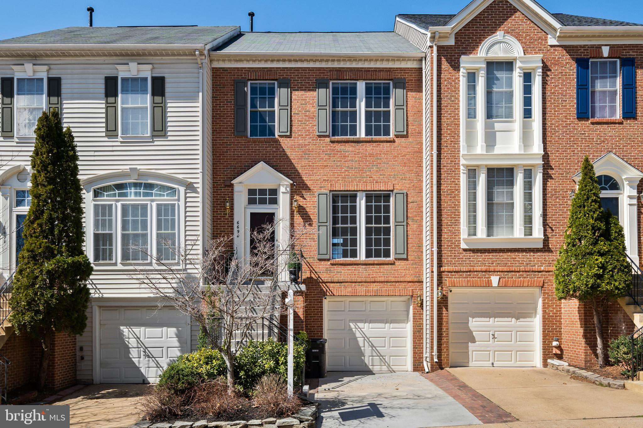 Welcome to this elegant three-level brick-front townhouse, featuring 3 bedrooms, 2.5 bathrooms, and a one-car garage. The main level offers a spacious living area that seamlessly flows into an updated kitchen equipped with ample white cabinetry, quartz countertops, and stainless steel appliances. The adjacent dining area looks out onto private, wooded common space. Upstairs, the primary suite boasts hardwood flooring, a walk-in closet, and a luxurious en-suite bathroom with a soaking tub, separate shower, and double vanity. Two additional bedrooms and a full bath complete the upper level.

The lower level includes a cozy family room with a gas fireplace, laundry, and rough-in plumbing, allowing for an additional bathroom. Recent updates include new hardwood flooring in the primary bedroom (2020), main level hardwoods and stairs (2018), new appliances (2018), HVAC system (2012), garage door (2016), roof (2017), water heater (2019), and a remodeled main level powder room (2020). The property also features a resurfaced driveway and front stairs (2017), along with thoughtfully landscaped front and back yards. The HOA fee covers a shuttle to the Springfield Metro, as well as trash and snow removal, pool access, and road maintenance. Just 0.5 miles to the Franconia-Springfield Metro station, offering a seamless commute to DC!