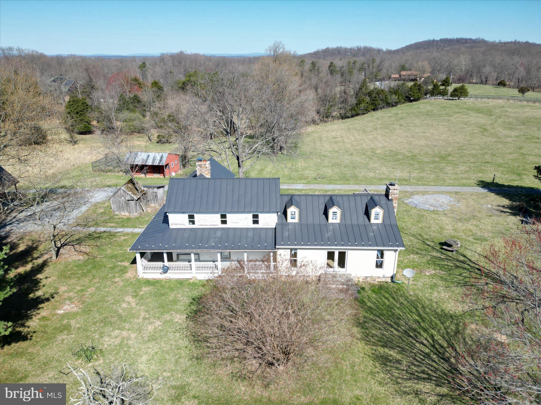 Charming Old Farmhouse on 64.5 Acres – RARE Find & Endless Potential!
Nestled on a sprawling 64-acre countryside, this rustic farmhouse is ready for your vision! Brimming with history and charm, the home features an unfinished addition, offering the perfect opportunity to customize your dream space. The land itself is a mix of open fields and woods—ideal for farming, recreation, or a private retreat complete with a pond.

The separate kennel building has great bones  and is waiting for the right owner to make it shine again.  Featuring a spacious layout with separate rooms, half bath, storage areas and bathing area.  The kennel building has its own heat pump, electric and septic tank.  The covered kennel area is equipped with a water pump and fans for the warmer days.  Fenced area for outdoor space is adjacent to the kennels.  Whether you're looking to start of expand a boarding, training or breeding operation, this is a fantastic opportunity to create the perfect setup.

While you have everything you need to live comfortably, there are some projects you'd like to tackle.  The setting is unbeatable—peaceful, private, and full of potential. Whether you're looking to restore a classic farmhouse, create a homestead, or invest in a country getaway, this property is a rare find. Bring your ideas and make it your own!

Other outbuildings include a three bay car shelter steps away from the rear entrance of the farmhouse; barn; smokehouse and a peacock house.  The property has a whole house Generac generator (600W) that's serviced by propane.

Located in beautiful Clarke County between Routes 50 & 7 for easy commuting to Northern Virginia, Berryville or Winchester.