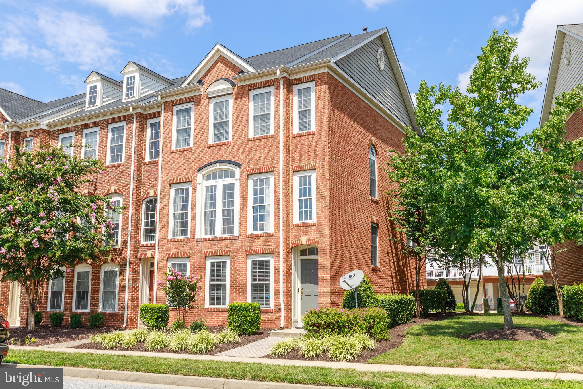 MULTIPLE OFFERS RECEIVED.  HIGHEST AND BEST BY SUNDAY 8/23, 5:00pm.  MUST SEE BRIGHT & SPACIOUS 4 BEDROOM, 2 FULL AND 2 HALF BATH BRICK FRONT END OF GROUP GARAGE TOWNHOUSE  WITH ONE OF THE BEST LOCATIONS IN HONEYGO VILLAGE!  ENJOY THE BEAUTIFUL NATURAL SUNLIGHT ALL DAY!  UPDATES INCLUDE ROOF 2019, AC 2018, AND S.S. APPLIANCES. FEATURES FOUR DOOR FRIDGE,  DOUBLE OVEN , AND BRAND NEW CARPET.  9 FT CEILINGS AND HARDWOODS THROUGHOUT  THE MAIN LEVEL.  HUGE REAR KITCHEN WITH LOTS OF 42" CABINETS, AND LARGE ISLAND WITH SLIDERS TO TREX DECK.  MASTER SUITE WITH SUPER BATH, AND WALK-IN CLOSET.   4TH  BEDROOM OR OFFICE ON THE ENTRY LEVEL WITH 2 CAR GARAGE AND TWO CAR PARKING PAD.  HOME FEATURES EXCELLENT STORAGE, EXTRA PARKING SPACES IN THE FRONT.  AND IS SUPER CONVENIENT TO EVERYTHING!