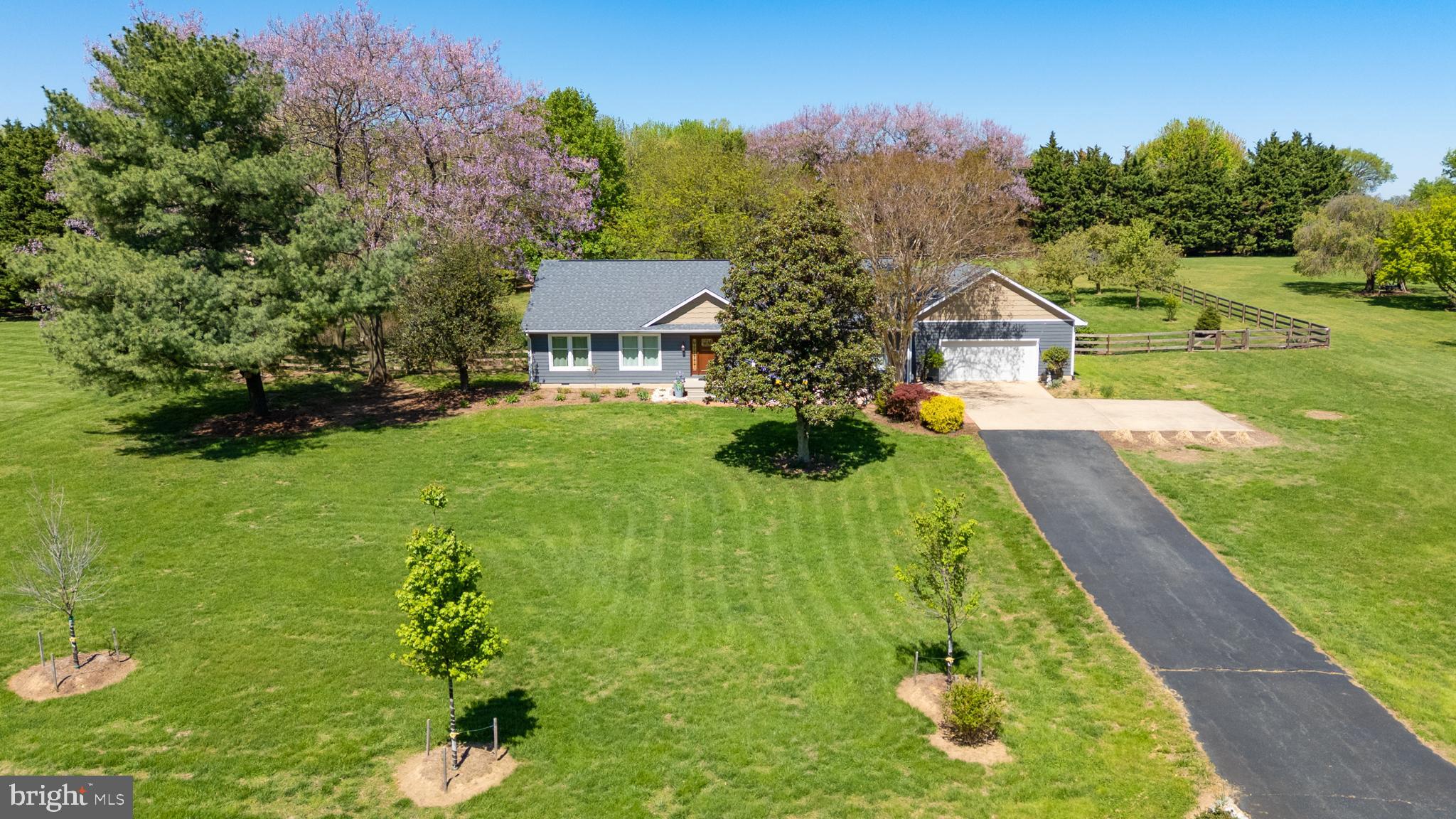 Privacy meets modern updates on two private acres in the sought-after Kinnaird’s Point community. This thoughtfully renovated home offers a peaceful setting with convenient access to the water, located just minutes from both Chestertown and Rock Hall. The property includes two community waterfront access points, featuring a private swim beach and boat launch along Still Pond Creek and Churn Creek. Inside, the bright, open single-level layout is centered around a fully remodeled kitchen with custom cabinetry, stone countertops, and a large island, flowing seamlessly into the living and dining areas. Outdoor spaces include a screened porch, composite deck, and stamped concrete patio, all designed to enjoy the home’s peaceful setting. The primary suite features a renovated bath, while additional bedrooms, updated bathrooms, and a dedicated office provide flexible living space. Major upgrades include a new HVAC system, new windows and doors, new siding, remodeled kitchen and bathrooms, a new water heater, spray-foam attic insulation, an encapsulated crawlspace, as well as full-house replumbing and an upgraded electrical system, offering a truly move-in ready, turnkey property. An oversized attached garage with a heated and cooled workspace and a fenced backyard add functionality and privacy. Tucked within a quiet, secluded neighborhood yet close to waterfront towns, marinas, and dining, this property delivers a well-updated Eastern Shore retreat with easy access to the water.