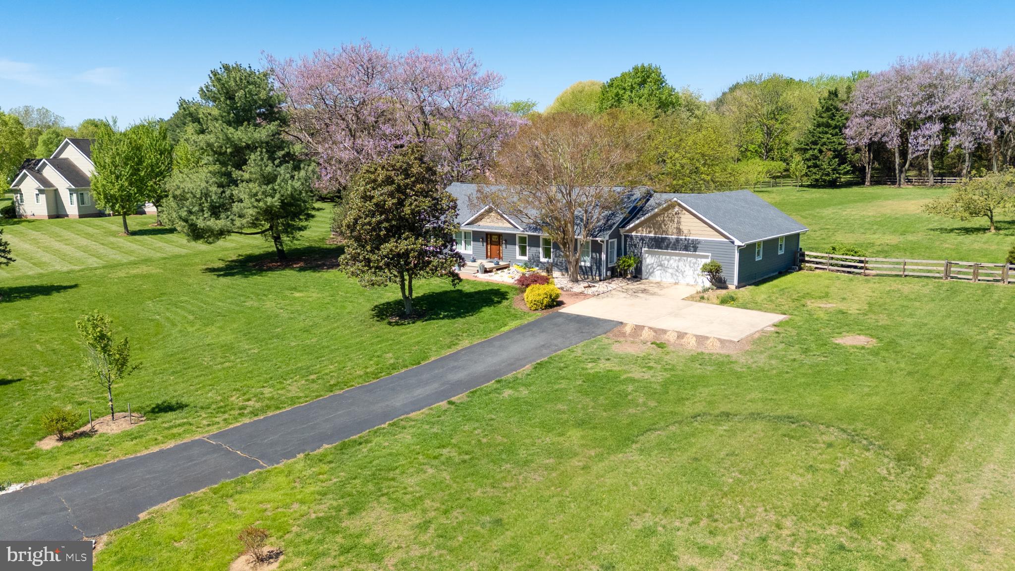 Privacy meets modern updates on two private acres in the sought-after Kinnaird’s Point community. This thoughtfully renovated home offers a peaceful setting with convenient access to the water, located just minutes from both Chestertown and Rock Hall. The property includes two community waterfront access points, featuring a private swim beach and boat launch along Still Pond Creek and Churn Creek. Inside, the bright, open single-level layout is centered around a fully remodeled kitchen with custom cabinetry, stone countertops, and a large island, flowing seamlessly into the living and dining areas. Outdoor spaces include a screened porch, composite deck, and stamped concrete patio, all designed to enjoy the home’s peaceful setting. The primary suite features a renovated bath, while additional bedrooms, updated bathrooms, and a dedicated office provide flexible living space. Major upgrades include a new HVAC system, new windows and doors, new siding, remodeled kitchen and bathrooms, a new water heater, spray-foam attic insulation, an encapsulated crawlspace, as well as full-house replumbing and an upgraded electrical system, offering a truly move-in ready, turnkey property. An oversized attached garage with a heated and cooled workspace and a fenced backyard add functionality and privacy. Tucked within a quiet, secluded neighborhood yet close to waterfront towns, marinas, and dining, this property delivers a well-updated Eastern Shore retreat with easy access to the water.
