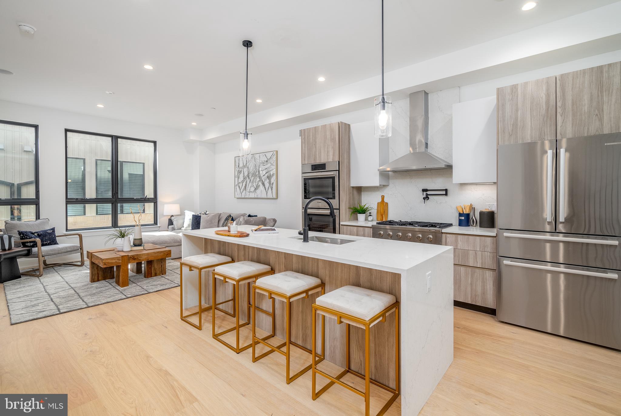 Extra large, 20-foot-wide new home at Artist Village, Philadelphia's brand new community of spectacular stately residences. With its prominent location at 17th & Bainbridge Streets in the heart of the historic Graduate Hospital, this unique enclave of homes will transform an entire city, bringing new life to a treasured neighborhood. Developed by The Regis Group & Ingerman Company, the first phase of Artist Village offers twelve luxury townhomes running parallel down 17th St and Colorado St. Each residence has been expertly designed, by JKRP Architects, with a layout that perfectly blends form with function. Every home will have private 1-2 car garage parking, an expansive roof deck - three outdoor spaces total, a tax abatement, elevators in the 17th Street homes and smart-home technology throughout plus the homes on 17th Street each have an elevator! A handsome brick facade greets you at the home's exterior. Once inside, you'll discover a completely open main level with a living room and dining area filled with natural light from tall windows. The stunning chef's kitchen, adorned with top-of-the-line appliances, custom cabinetry, and designer finishes, is sure to become the heart of the home! The lower level has the all-important 1-2 car garage parking and a bonus space ideal for a home theater, playroom, or gym. The second level has two bright bedrooms, two full bathrooms, and a conveniently located laundry closet. The primary suit covers the entire third level, acting as a private retreat. There's a large bedroom with great natural light, a custom walk-in closet with space to share, and a luxurious bathroom fitted with a double vanity, soaking tub, rainfall shower, and a water closet. Topping off this amazing home is a one-of-a-kind bi-level roof deck! With a powder room and wet bar equipped pilot house, tons of space to spread out, and mesmerizing views of the city, this is an entertainer's paradise! Not only is Artist Village a fantastic development, but it's also in an equally fantastic neighborhood. This highly sought-after Graduate Hospital location earns a WalkScore of 97! Nearby, South Street is lined with local restaurants, shops, and markets. Fine dining, luxury shopping, and lively entertainment can be found in neighboring Rittenhouse Sq, plus Target, Sprouts Farmers Market, and Wine & Spirits are less than a 10-minute walk. This central location also provides easy access to Broad St, Washington Ave, Jefferson Hospital, Pennsylvania Hospital, University City, and I-76. Artist Village presents a rare opportunity not to be missed. The time is now to reserve your home, customize your finishes, and plant your roots in Graduate Hospital's next chapter. The top floor flex space can easily be converted into a fourth bedroom; a door can be added for privacy. Taxes and square footage are the responsibility of the buyer to have verified. Association fees are TBD. Photos/renderings are for marketing purposes only and may not portray actual finishes.