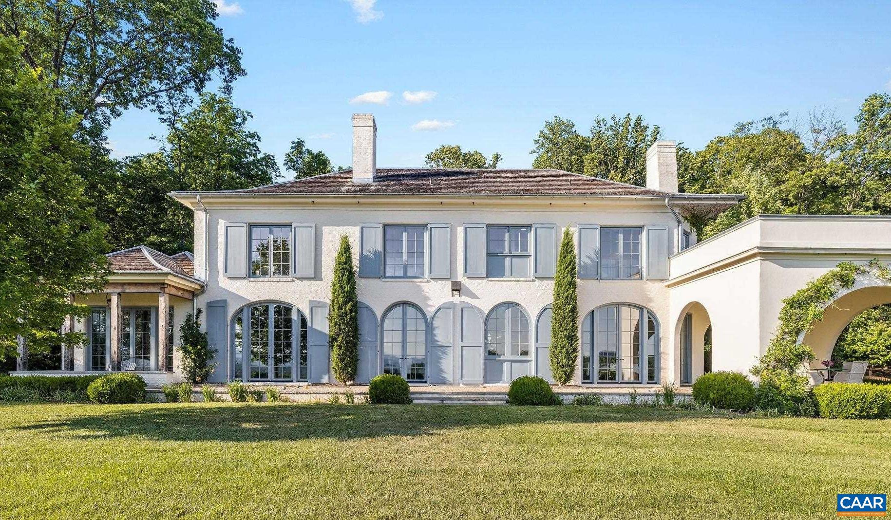 An exquisite brick, stone & stucco residence completed in 2021, Sunday Lilac truly transports one to the French or Italian countryside. The only giveaways are the stunning, layered Blue Ridge views evident from most rooms. The world class design, construction & finish are showcased at every turn, from hand laid, reclaimed French oak floors to imported marble fireplaces to extensive, elegant metalwork, Murano glass chandeliers & Delft tilework. Landscape design by Alex Smith includes a pollinator garden & walled flower garden with marble feature next to the entryway.  The front & rear elevations are equally striking, with handmade, functioning shutters, gas lanterns & extensive bluestone & limestone hardscaping. While this incredible residence breathes old world charm, its floor plan beautifully accommodates 21st c. lifestyles, with a seamless balance of formal & informal spaces. As one enters the striking foyer, the incredible views are immediately evident. The cook's kitchen opens to an expansive family room with beamed ceiling. The 1st floor primary offers his & her walk-ins & adjacent laundry/flower room. Upstairs are 4 ensuite bedrooms, 2nd laundry room & home office or sitting room. 22 acres of total privacy & tranquility.,Marble Counter,Oak Cabinets,Fireplace in Family Room,Fireplace in Living Room