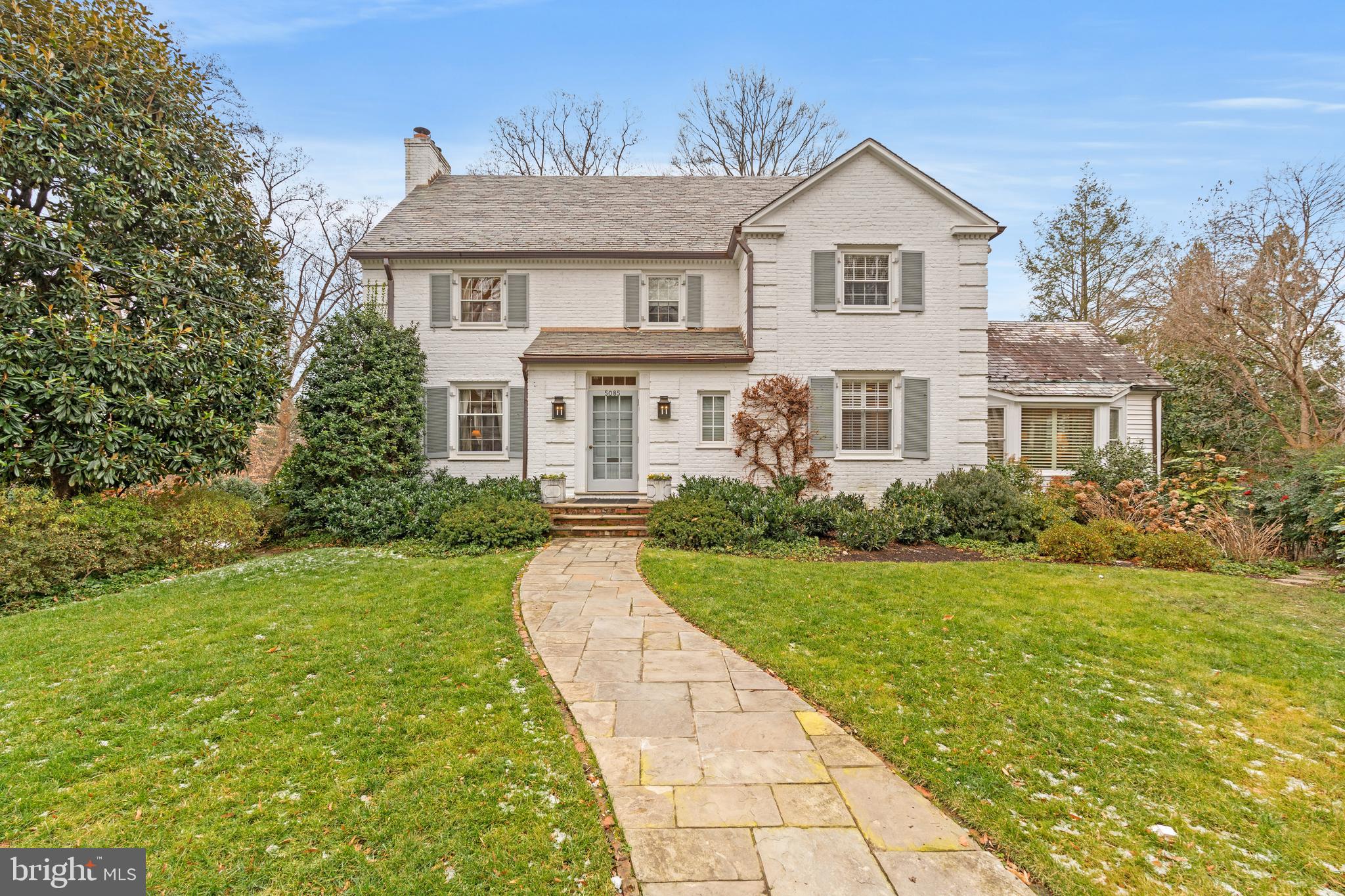 Situated at the end of a peaceful cul-de-sac on beautiful Lowell Street in Kent, this distinguished 1940 Colonial is set amid more than 17,300 square feet of landscaped gardens.  Spanning over 6,000 square feet of gracious living space, the home features six bedrooms and four full and two half baths, blending classic traditional details with a bright, modern floor plan.  The expansive main level is perfect for entertaining with light filled rooms, a welcoming foyer, a spacious living room that flows into a large sunroom with floor to ceiling windows.  A gracious dining room with French doors opening to a full-length rear deck, while the updated kitchen with breakfast area flows to a spacious family room with a wood & gas  burning fireplace, custom book cases, and a set of 2 French doors to the rear deck.  The expansive lower level is filled with natural light and includes another spacious family room, a bedroom with full bath, a half bath, a gym, storage, and access to the garage.  The cul-de-sac offers a haven for neighbors to meet and children to play! Shopping & amenities along MacArthur Blvd are just steps away along w easy access to downtown, the Capital Crescent Trail , Georgetown and the airports.
