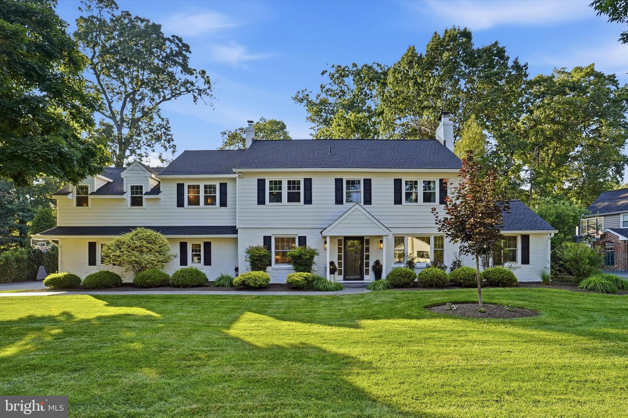 Welcome to 417 Heatherwood Lane—a beautifully updated Devon residence where timeless sophistication meets modern convenience. Set on a picturesque, tree-lined street in the highly sought-after Tredyffrin-Easttown School District, this exceptional 4-bedroom, 3 full and 1 half bath home offers refined living spaces, thoughtful updates, and outstanding curb appeal.
From the moment you arrive, you’ll be captivated by the gorgeous manicured landscaping, mature trees, and Brick/Hardie® Board siding, creating a warm first impression. Inside, stunning wide-plank white oak flooring, abundant natural light, and modern millwork create an atmosphere of grace, sophistication, and timeless style.
Designed for both everyday living and effortless entertaining, the beautifully renovated eat-in kitchen features quality finishes, quartz countertops, abundant inset cabinetry, and combined seamlessly with the dining room, creating an inviting space for family and friend gatherings. The spacious family room features a cozy fireplace, while the office/bonus room offers a versatile retreat with its own fireplace and sliding glass door that open to the patio—perfect for a home office, playroom, reading space, or additional entertaining area.
The beautifully renovated mudroom and laundry room has been thoughtfully updated with designer tile flooring, custom built-ins, a coffee station, honed granite, beverage refrigerator, and storage—bringing functionality to everyday living.
The exceptional primary suite is a true private retreat, featuring a spacious sitting room, dedicated additional laundry area, generous walk-in closets, and a spa-inspired en-suite bath. The luxurious bath showcases quartz countertops, dual vanity, large-format tile, a freestanding soaking tub, and a beautifully tiled walk-in shower. Two additional bedrooms, 1 hall bath, and another ensuite bedroom provide exceptional comfort and flexibility for family and guests. A Cedar closet in the floored attic (with new attic door/ladder) provides extra storage. 
A beautifully maintained home with recently replaced windows throughout the house and asphalt roof (2019) with transferable 20 year GAF warranty offer a piece of mind to the most discerning buyer.
An attached two-car garage with an updated garage door opener adds additional functionality and ease.
Outside, privacy, manicured landscaping, newer hardscaping and fenced in backyard create the perfect setting for relaxing or enjoying the beauty of every season. 
Perfectly positioned just minutes from downtown Wayne, Devon Yard, the Devon Horse Show Grounds, premier shopping and dining, SEPTA Regional Rail, and major commuter routes, 417 Heatherwood Lane offers an exceptional blend of modern updates, comfort, and convenience.