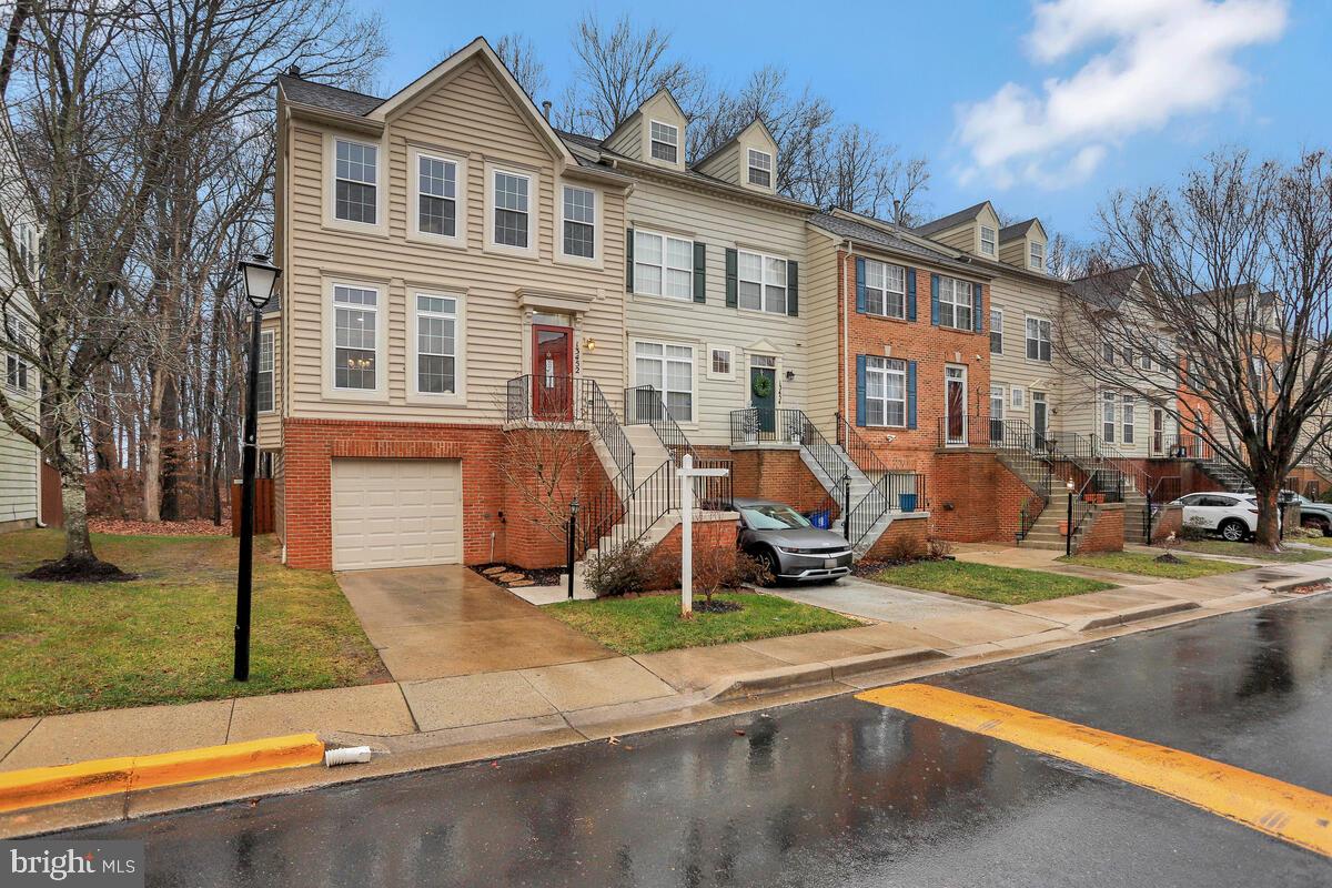 Welcome to this breathtaking, end-unit townhome, ideally located close to major commuter routes and surrounded by local amenities. Situated in a quiet, desirable neighborhood that exudes a welcoming atmosphere, this home is a perfect retreat for those seeking convenience, modern living, and tranquility.

As you approach your-soon-to-be new home, you'll be greeted by an overwhelming sense of pride. The freshly painted steps, well-groomed lawn, and vibrant garden area create a picture-perfect first impression. The clean and bright exterior sets the tone for what awaits inside.

Upon entering, you'll be captivated by the flawlessly flowing layout that extends from the front door to the brand new (2023) back deck. The deck provides a serene vantage point overlooking a peaceful, healthy, lush, and beautiful forest, seamlessly blending the boundaries between indoor and outdoor living. It's impossible not to imagine relaxing here while enjoying your morning coffee, or unwinding while watching the breeze gently flow through the trees after a busy day. 

The interior, freshly painted in 2023, is illuminated by glowing light fixtures that enhance the overall ambiance, which is even further highlighted by the sunlight stretching through the oversized windows. The focal point of the living space is the double-sided fireplace, offering enjoyment from both the living room and the dining room. The kitchen is a chef's delight, equipped with gorgeous stainless steel appliances, a convenient island with a breakfast bar, Quartz countertops (2024), and a drop-in sink (2024) with a new garbage disposal (2023). To top it off, the kitchen holds room for gathering around a large dining table with your loved ones. A half bath and walk-in coat closet conveniently sit in the hallway. 

Heading upstairs, you'll discover three spacious bedrooms, each with ample closet space. While there is a full bath in the hallway located near two of the bedrooms, the primary suite includes its own, private en suite. The primary bedroom is a sanctuary with plenty of space for your larger furniture items, a spacious walk-in closet, and oversized windows to, once again, allow the warmth of sunlight to gently wake you at the start of the day.. The en suite showcases a double vanity, oversized shower, and luxurious soaking tub with high ceilings to make the already-large space feel even bigger.

But, wait! There's more. The bottom level of the home offers a large finished space, providing versatility for various uses such as an additional bedroom, office, home gym, or second living space. Two sizable storage closets, a slider exit to a covered patio, and fully fenced, private backyard make this level the perfect space to truly make your own. Additionally, there's a designated laundry area, space for more storage, easy access to the newer HVAC and water heater, and a separate entrance to the private garage. If the driveway and garage parking are still not quite enough to suit your needs, additional parking is a breeze with multiple options just a few feet away from your front door.

This meticulously maintained and updated townhome offers a perfect blend of comfort, style, and functionality-words simply can't describe its beauty. Don't miss the opportunity to call this inviting property yours!