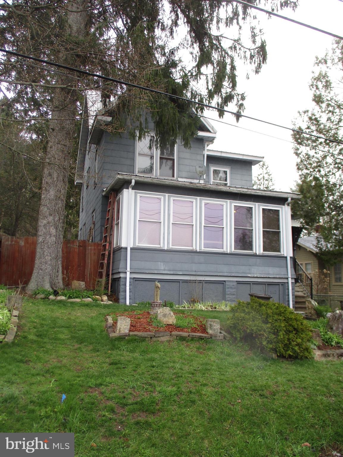 3 bedroom 2 story dwelling on quiet city street. enclosed porch front & rear. 2 car Detached garage. Estate property