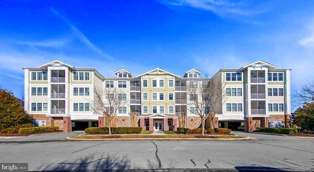 PRICE IMPROVED & FULLY FURNISHED—Your Turnkey Bayside Escape Awaits!

Experience the pinnacle of coastal living at an unbeatable new value in the award-winning Bayside community. This wonderfully maintained 3-bedroom, 2-bathroom condo offers over 1,600 square feet of open-concept space, perfectly situated just steps from Twin Parks and the premier pools and fitness areas at Sun Ridge Rec Center. To make this move even more effortless, we are offering an incredible $5,000 credit toward your Bayside Sports Membership with a full-price offer, giving you immediate access to world-class amenities. Inside, you'll find hardwood floors, a cozy gas fireplace, and a private screened porch with serene park views. The primary suite serves as a true sanctuary with a spacious sitting area and tiled ensuite, while the flexible third bedroom easily transforms into a home office or den. Complete with reserved covered parking and a dedicated storage room on the same floor, this home is designed for total convenience. From the Jack Nicklaus signature golf course and bayfront pools to the nearby beaches of Fenwick Island, every resort-style luxury is at your fingertips. This is low-maintenance luxury at its finest—turnkey, move-in ready, and priced to sell. Schedule your tour today and claim your piece of paradise before summer arrives!