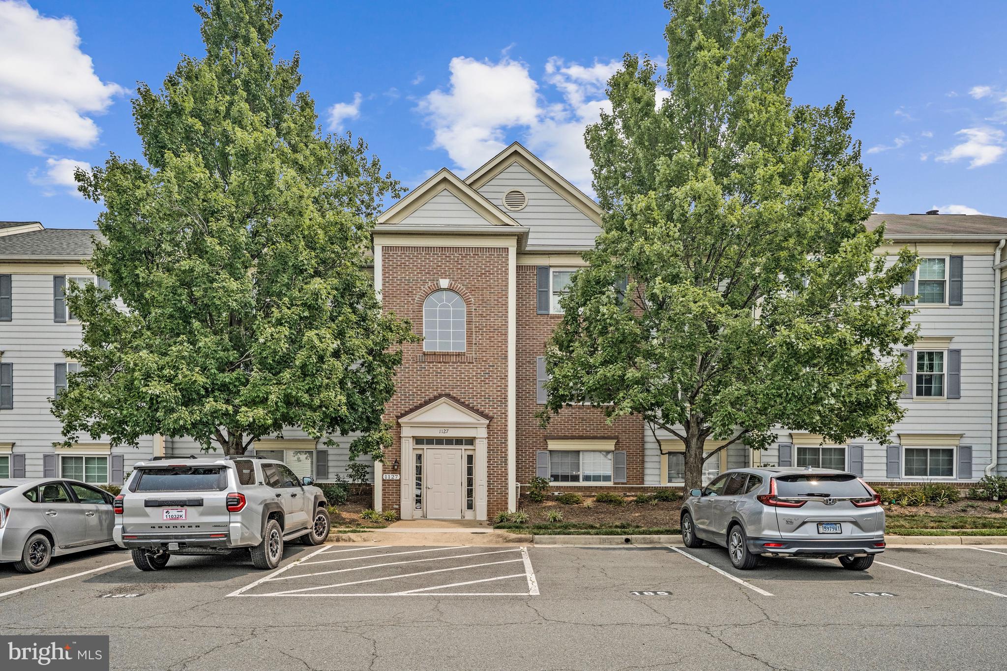 Welcome home to this beautifully maintained 2-bedroom, 2-full-bath condominium offering comfort, convenience, and low-maintenance living. Backing to wooded views, this home provides a private retreat while being just minutes from the shops, restaurants, and charm of Historic Old Town Leesburg, as well as major commuter routes and everyday conveniences. Inside, you'll find attractive wide-plank flooring throughout the main living areas, a spacious and light-filled floor plan, and thoughtfully updated bathrooms. The well-appointed kitchen features a new microwave and stove (2025), dishwasher (2023), and ample cabinetry, making meal preparation both functional and enjoyable. The washer was replaced in 2020, adding to the home's long list of updates. Both generously sized bedrooms feature walk-in closets, providing exceptional storage, while the primary suite offers the privacy and convenience of an en-suite full bath. Major system updates include a brand-new HVAC system (2026) and hot water heater (2020), providing added peace of mind for the new owner. Additional features include one assigned parking space (#185), additional HOA parking permits available for residents, and Mailbox #202. Move-in ready and exceptionally maintained, this inviting condo combines modern updates, private wooded views, and an unbeatable location just minutes from Historic Old Town Leesburg, making it the perfect place to call home.