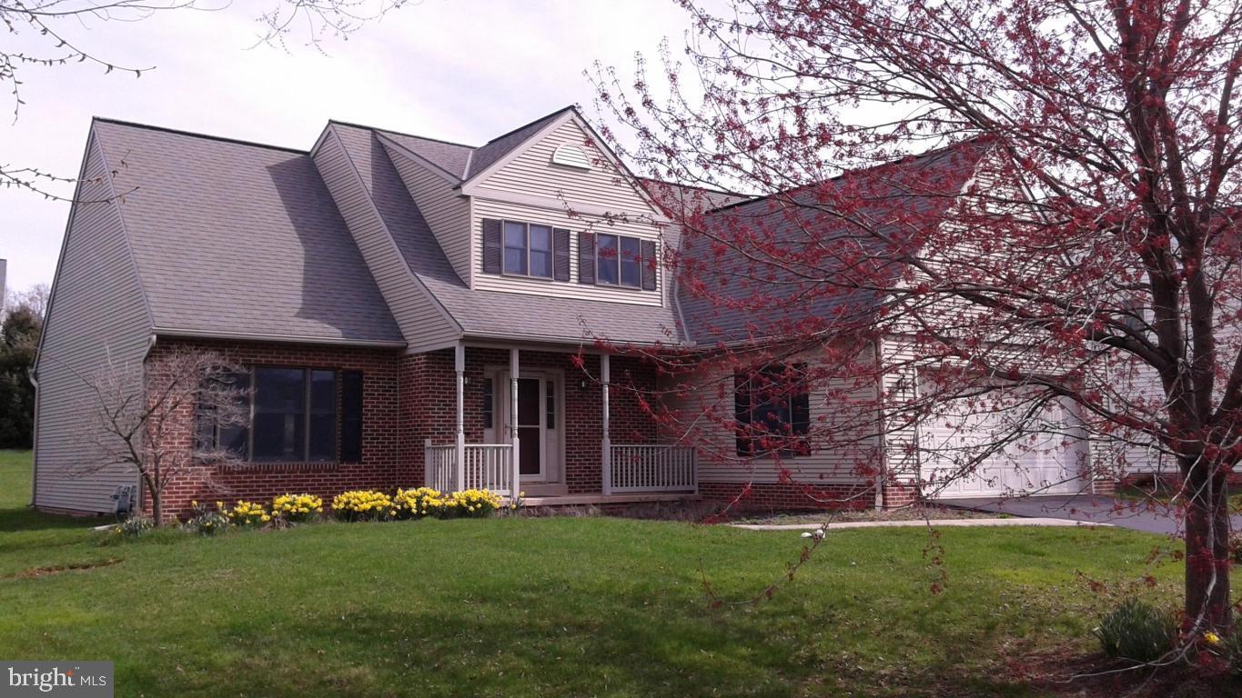 Nice brick and vinyl traditional with a cathedral great room ceiling, a first floor owners suite with a Jacuzzi tub, a walk-in closet, first floor laundry room and a bright kitchen/dining area with oak cabinetry. Large basement with ample storage. Fresh paint and new carpet throughout. Nice yard and rear deck. 2 car garage.