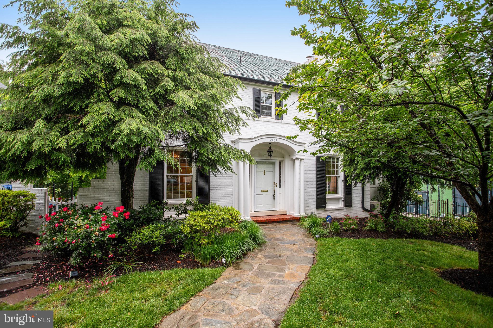 Tucked away on a picturesque block in Forest Hills, this center hall colonial boasts a rare level exterior entrance and an open floorpan that masterfully blends timeless architecture with sophisticated, modern finishes. The heart of the home is a stunning chef's kitchen equipped with Thermador appliances, custom cabinetry and ample counter space leading seamlessly into a house wide length of great room opening onto a full length wide deck with sylvan views and large rear yard.
With 5 bedrooms and 5.5 bathrooms across four expansive levels, this home delivers exceptional space, functionality, and design in one of DC's most sought -after neighborhoods.