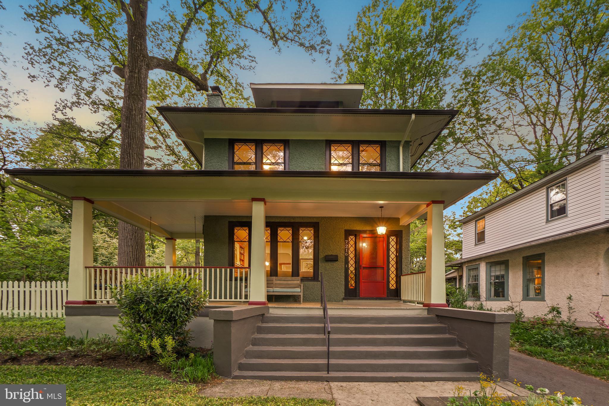 Spectacular, picturesque Craftsman Colonial with an inviting wraparound porch, located in the highly sought-after Takoma Park Historic District. Built circa 1913, this recently renovated home offers a gracious combination of vintage charm and modern convenience. Stately four-bedroom, two-and-a-half-bath property with abundant architectural details, including reproduction trims throughout, windows with detailed grilles, newly refinished wood floors, a stately mantel with built-ins, and recessed lighting - and a laundry chute! This residence features a gourmet kitchen, a living room with a brick fireplace flanked by display shelving and custom cabinetry, a large open dining room with a modern chandelier, and a generous sunlit family room overlooking the backyard. The kitchen includes granite counters, gas cooking, a French door refrigerator, wood cabinetry, ample prep space, (including a fold-out table specifically for littles,) and a butler’s pantry. The main level is complete with a powder room and a mudroom area. 
The upper level offers four bedrooms and two full bathrooms, including the primary suite. The primary bedroom has a walk-in closet and a private en-suite bathroom. The hall bathroom is renovated and well appointed. One of the secondary bedrooms has a balcony overlooking the grounds. There is a large unfinished attic with storage. Downstairs, there is ample storage and a laundry area.
Enjoy the outdoor living space, relax on the wraparound front porch, grill and dine on the deck, or spend time in the 11,250 square foot backyard. The bonus lot ensures your sense of remove for it all - except for on July 4th, when the yard is, by custom, host to the annual neighborhood potluck.  The property also includes a detached garage - a future workshop or studio? - and a patio suited for a fire pit.
Enjoy living in eclectic Takoma Park; the location offers both charm and convenience, situated just steps from parks and playgrounds, the farmers’ market, food Co-op, shops, Red Line Metro station, Ace Hardware, and Busboys & Poets. Relish the sense of community as well as access to shopping, restaurants, and entertainment. See you there!