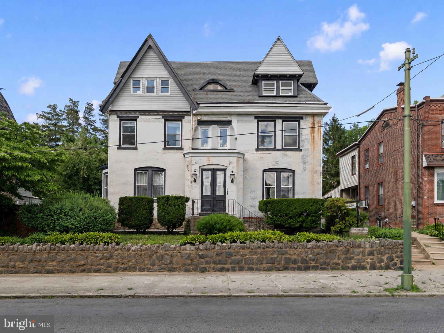 Welcome to 1125-27 Arrott Street, a rare and impressive detached home in the Northwood section of Philadelphia, situated on an oversized parcel with nearly 3,000 square feet of above-grade living space and a truly exceptional yard. This grand home offers size, classic character, flexibility, and long-term potential that is difficult to find in the city.

Step inside through the double-door entry into a spacious center hall featuring original woodwork, high ceilings, a beautiful staircase, decorative glass details, and large sun-filled rooms. The main level offers a generous living room, formal dining room, and a spacious kitchen ready for the next owner’s personal updates. Just beyond the kitchen is a large butler’s pantry, a convenient laundry area, and access to the screened-in porch, creating an easy connection to the outdoor living space and expansive backyard.

The second floor features three large bedrooms, including two front bedrooms and a large rear bedroom. This level also includes an updated full bathroom with a modern walk-in shower, plus an additional hall bath with a clawfoot tub, adding both character and functionality. A rear staircase near the updated bathroom provides secondary access down to the kitchen area, a classic and convenient feature that enhances the home’s flow.

One of the standout features of this home is the large third floor, featuring new windows installed in 2026 and offering excellent potential for additional finished living space, a future primary suite, home office, studio, recreation area, or possibly two additional bedrooms. The unfinished basement provides storage and utility space.

The rear yard is a major highlight, offering a screened-in porch, mature landscaping, garden areas, and plenty of room to entertain, relax, or enjoy a private outdoor setting.  It also features a hot tub area set on a platform over newly installed pavers, adding another unique outdoor feature for the next owner to enjoy.

For the homeowner with vision, this is a rare opportunity to create an estate-style residence within the city, offering the space, privacy, and outdoor setting to feel like a true retreat. The oversized yard, screened porch, mature landscaping, garden space, and hot tub setup create the foundation for a private outdoor oasis with room to relax, entertain, garden, and enjoy.

While ideal for an owner-occupant looking for a one-of-a-kind Northwood home, the property’s size, layout, and 1125-27 address may also be enticing for a savvy investor exploring possibilities such as a multi-unit conversion, room rental strategy, house-hacking setup, or other long-term flexible use. Any desired future use, conversion, rental use, zoning change, permits, licenses, or approvals are the sole responsibility of the buyer and should be independently verified with the City of Philadelphia.
