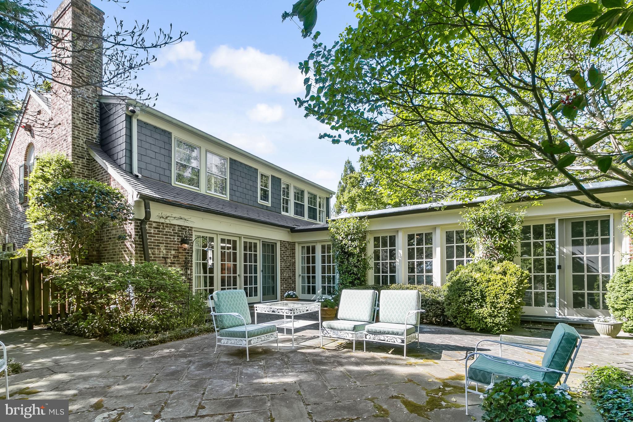 NEW PRICE ! EASY TO SHOW! OVERLOOK - WESTMORELAND HILLS, WELCOME TO 4423 BOXWOOD ROAD with water views and a first-floor bedroom (currently used as a library). Set among tree-lined streets, 4423 Boxwood Road is a charming 4 bedroom, 4 full-bath retreat in the heart of the Overlook community with 4306 sq ft of interior space on 3 levels. The home overlooks an expansive open green space maintained by the HOA. The private side-garden entrance opens to a welcoming foyer which leads to the living room with a wood-burning fireplace and French doors leading to the extensive terrace with boxwood, climbing quince, hydrangea and large dogwood trees. The living room flows into an open concept dining room complete with a wet bar, making it an ideal space for entertaining. Next to the dining room is the gourmet eat-in kitchen/family room with a large island, fireplace, built-in cabinetry, a washer and dryer, and water views. This large, light-filled addition also enjoys patio access, creating seamless indoor/outdoor living, a rare find so close to the city! A first-floor bedroom or library complete with custom built-ins offers flexible space for main level living and is adjacent to a full bath and large closet. A single garage with interior entry adds everyday convenience to the main level. Upstairs, a sun-filled primary bedroom with a large ensuite full bath features 3 dormer windows and two large closets. The additional two bedrooms are connected by a full bath. The lower-level features 8-foot ceilings, a spacious living space anchored by a wall of cabinetry, a full bath, a large storage/utility room and an additional closet. With its generous patio, water views, and private setting, this approximately 4,306 SF home represents the “best in class” in this desirable neighborhood with easy access to city living. Overlook is a friendly neighborhood with the conveniences of an active HOA, a private pool, and tree-lined sidewalks for leisurely walks through the quiet streets. Parks and trails are minutes away! The neighborhood is in close proximity to Spring Valley and Westbard Square shops and restaurants, Friendship Heights Metro, the Massachusetts Ave bus line, the Capital Crescent Trail, parks, downtown DC and Bethesda. Westbrook / Westland / BCC schools serve this elegant neighborhood. Showings by appointment only.