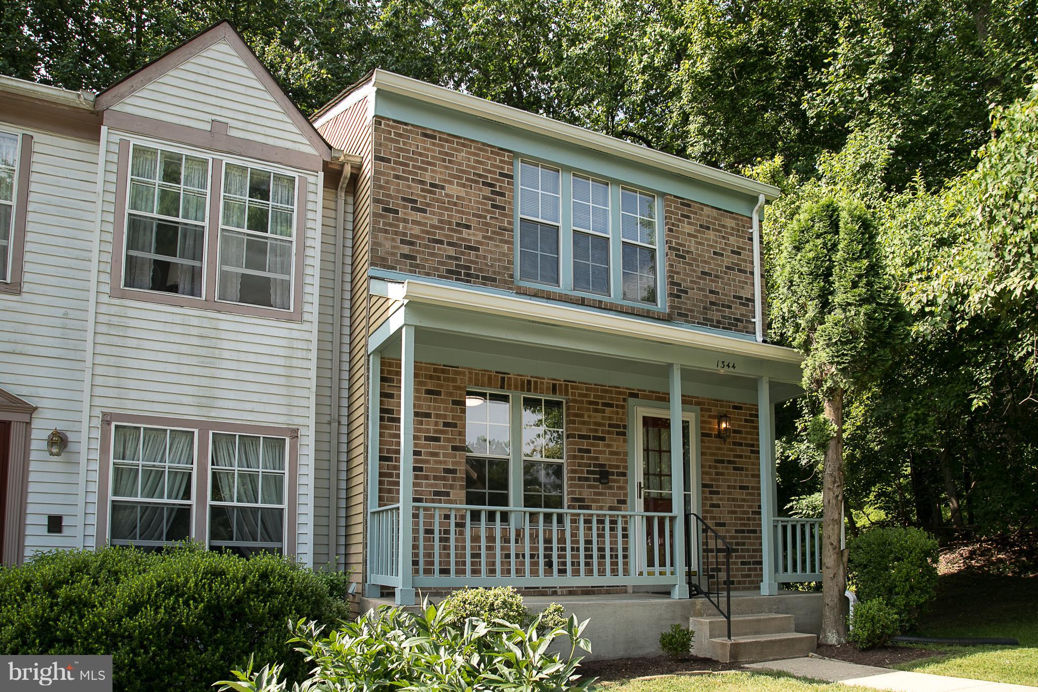 What a beauty. Gorgeous end of group with a very rare full front porch! Meticulously maintained and now new flooring in the foyer and kitchen! Brand new gas stove- Recently added refrigerator and dishwasher. Brand new carpeting throughout. Freshly painted in up to date colors through out! Finished lower level with fireplace and walk out. Big deck overlooking stunning large yard and woods! So Nice!