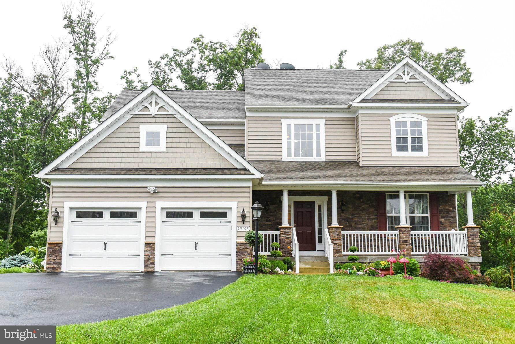 Simply Stunning!  Shows like a model home! 9' ceilings on all three levels.  Fully finished walkout basement with custom tile,wet bar and 2 additional  rooms w/closets.  Stainless appliances, granite counters, large kitchen island. Bumped out fam. room. Sep DR & LR. Upgraded lighting throughout.  Deck leads to a wonderful paver patio area for outdoor entertaining and a beautifully landscaped yard